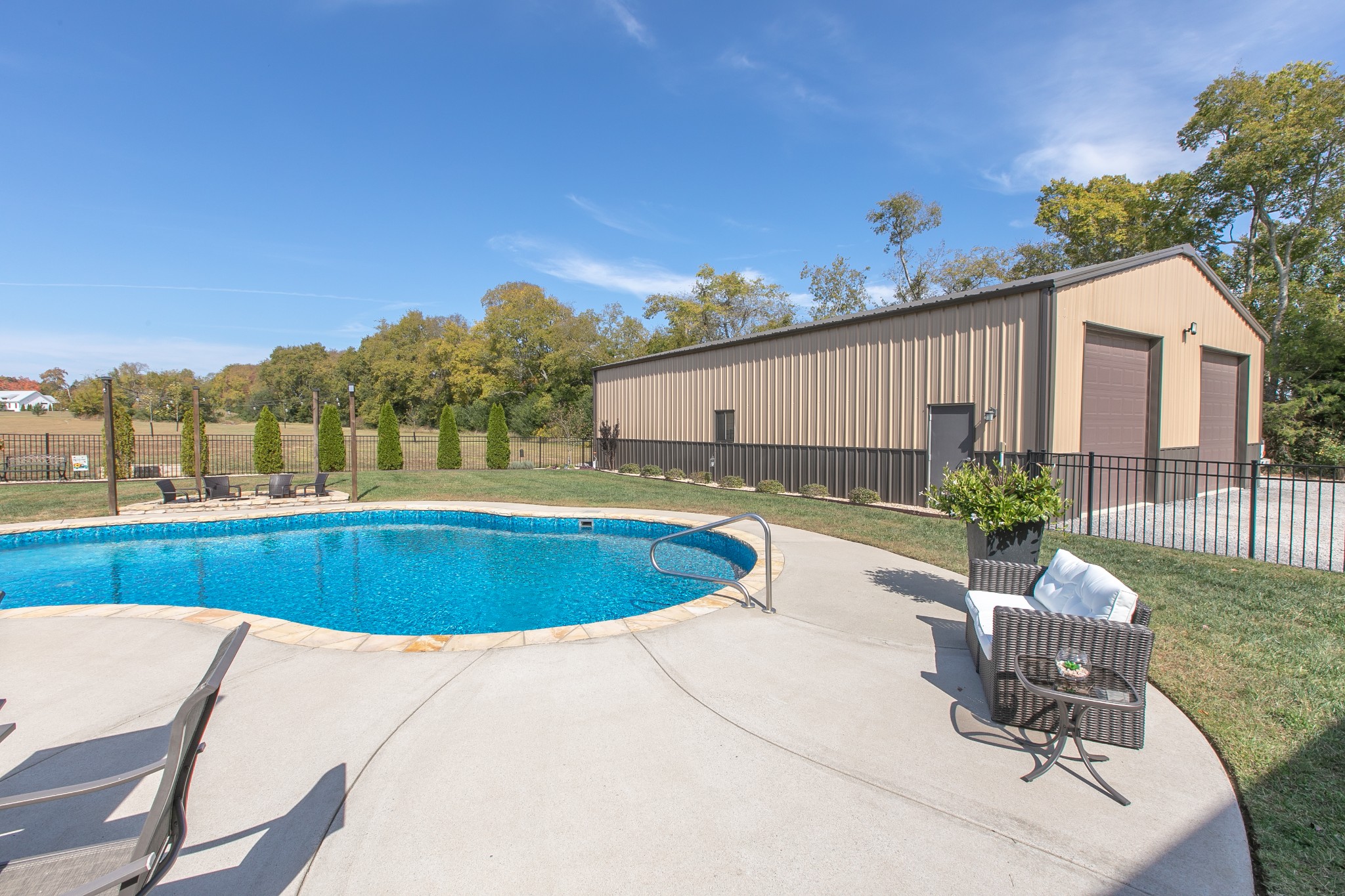 8478 Newtown Road Rockvale, TN 37153 - Photo 13 of 54 a view of a swimming pool with chairs