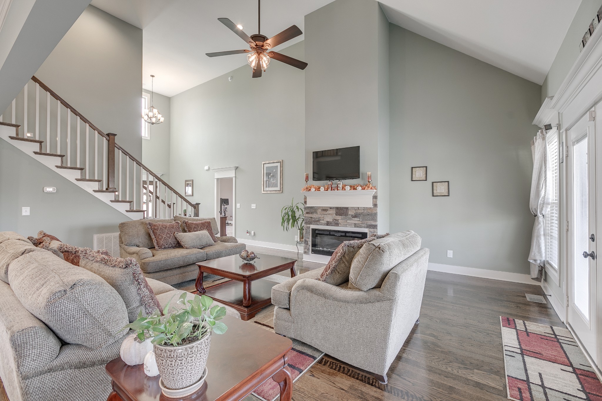 8478 Newtown Road Rockvale, TN 37153 - Photo 29 of 54 a living room with furniture a fireplace and a flat screen tv