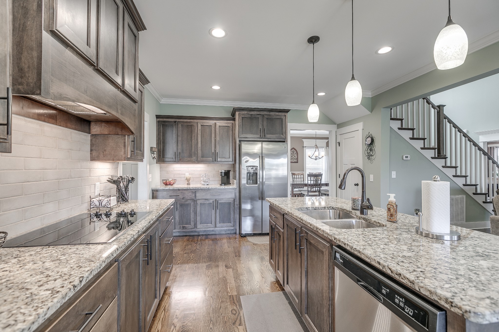 8478 Newtown Road Rockvale, TN 37153 - Photo 32 of 54 a kitchen with stainless steel appliances granite countertop a sink a stove top oven a counter space and cabinets