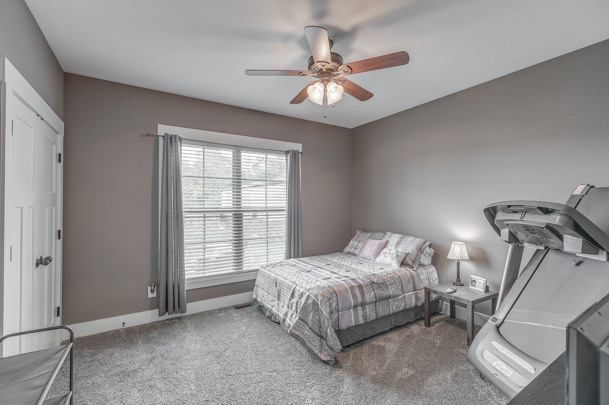 8478 Newtown Road Rockvale, TN 37153 - Photo 35 of 54 a bedroom with a bed and a chandelier