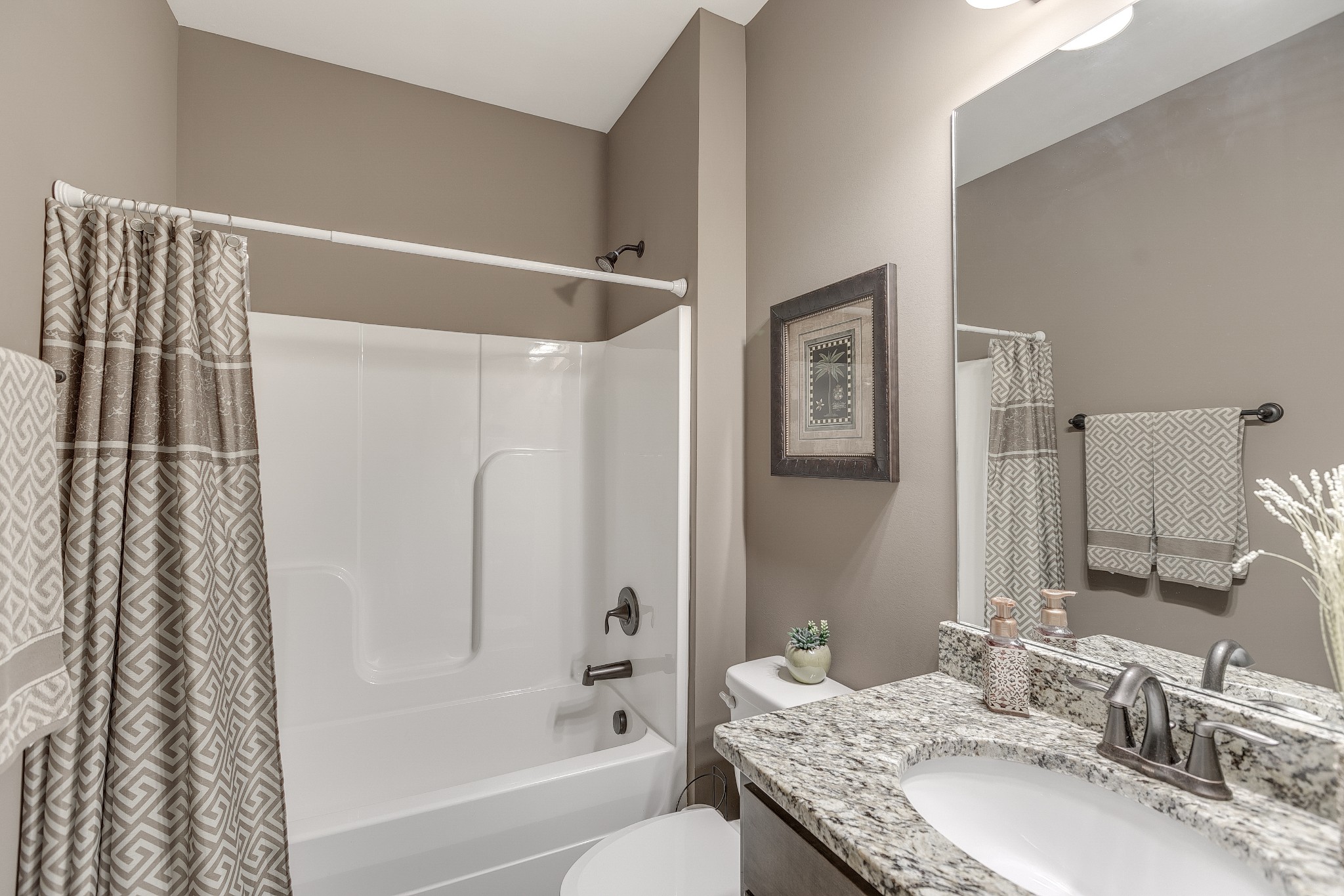 8478 Newtown Road Rockvale, TN 37153 - Photo 36 of 54 a bathroom with a granite countertop sink a toilet and shower