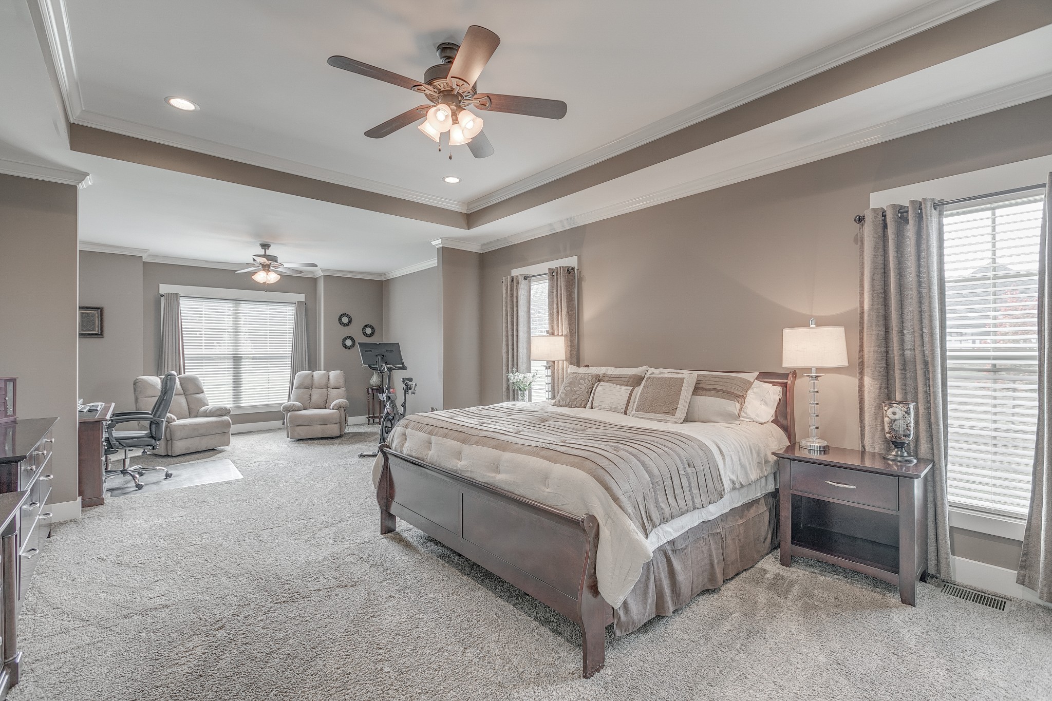 8478 Newtown Road Rockvale, TN 37153 - Photo 39 of 54 a spacious bedroom with a large bed a chandelier and windows