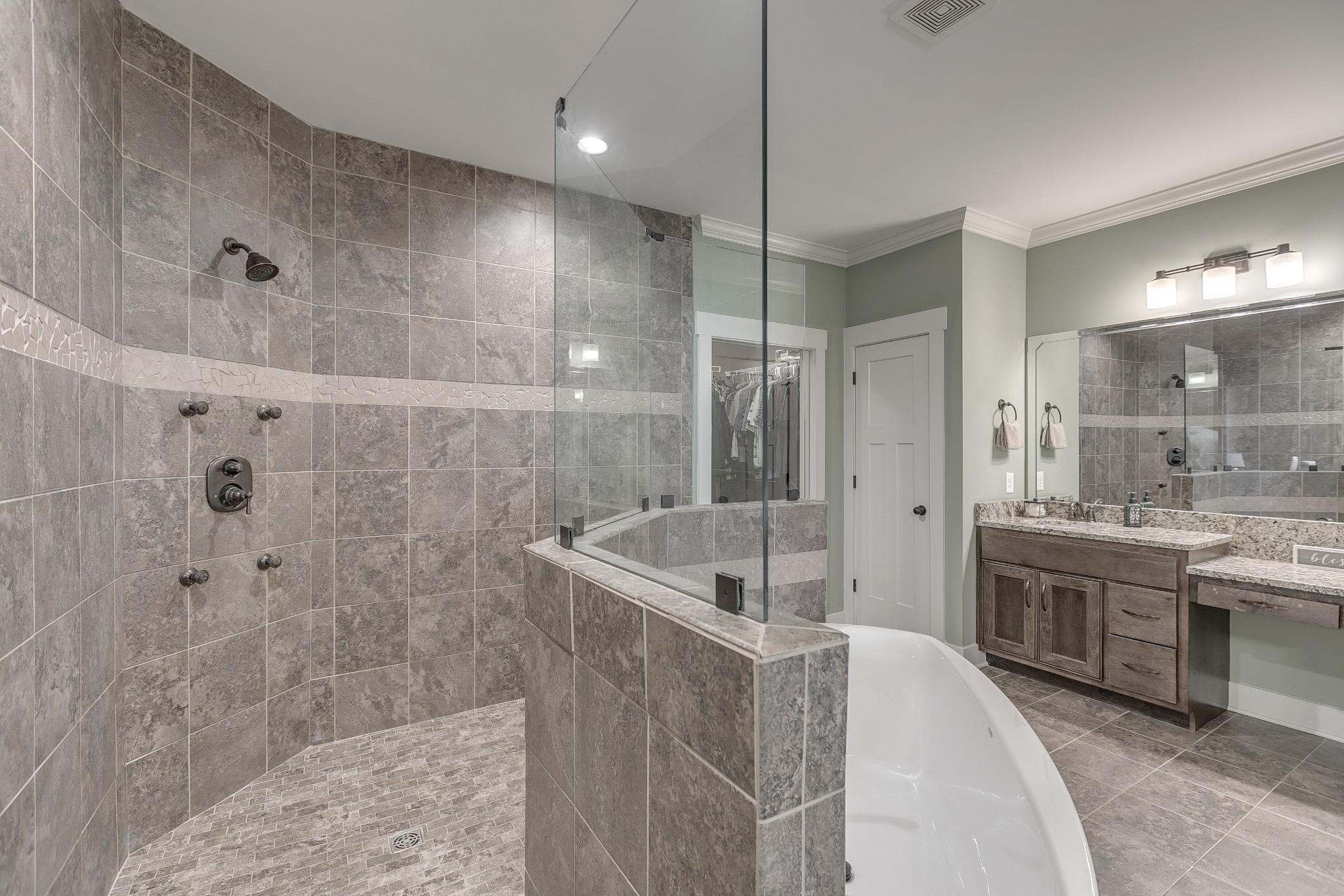 8478 Newtown Road Rockvale, TN 37153 - Photo 42 of 54 a spacious bathroom with a granite countertop sink a toilet a mirror and shower