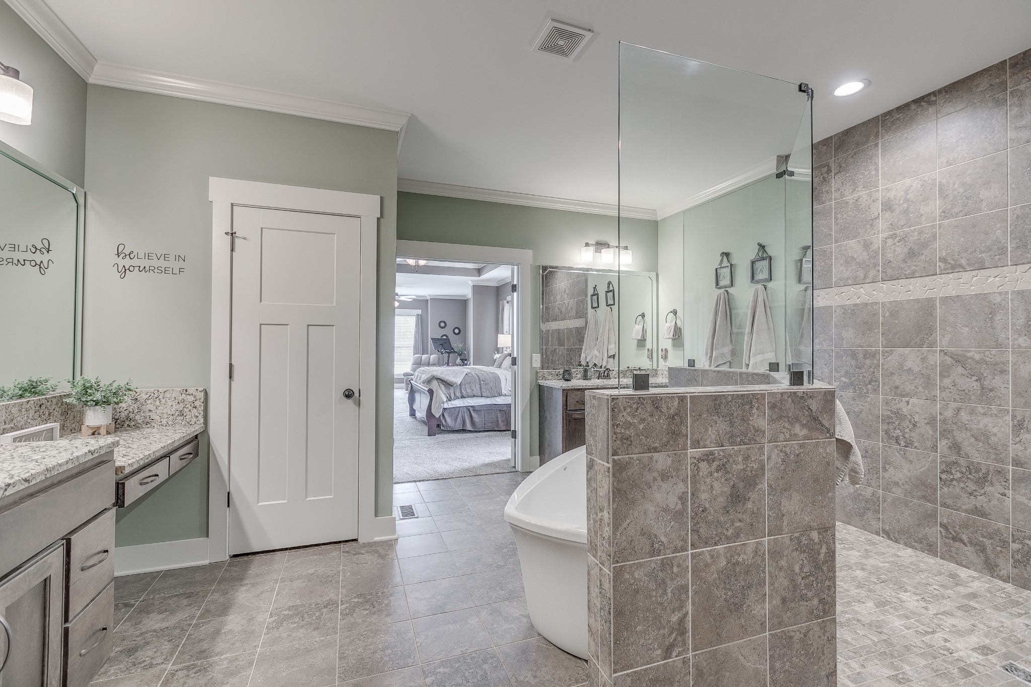 8478 Newtown Road Rockvale, TN 37153 - Photo 45 of 54 a bathroom with a double vanity sink a toilet a mirror and shower