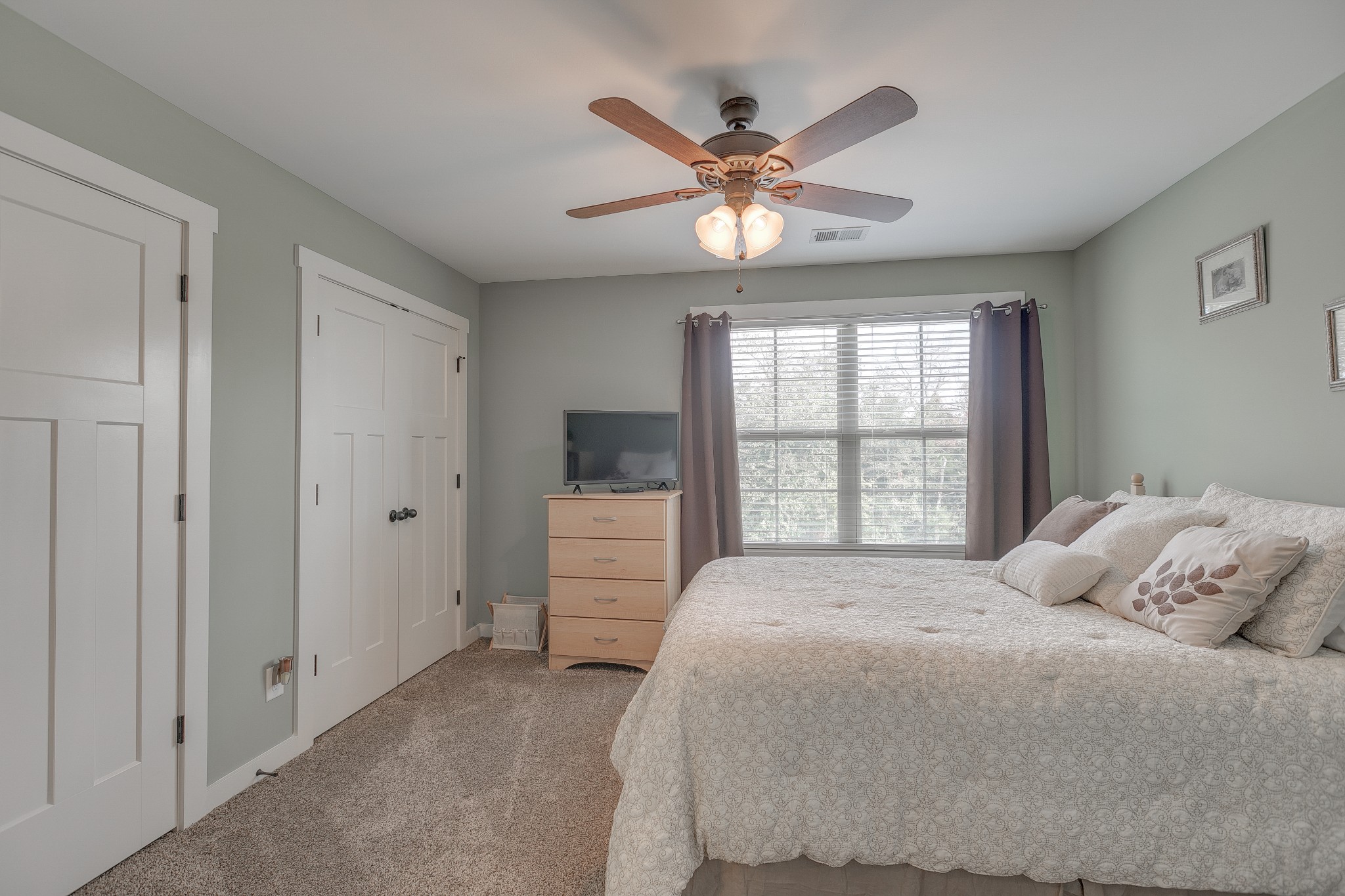 8478 Newtown Road Rockvale, TN 37153 - Photo 48 of 54 a bedroom with a large bed and a chandelier