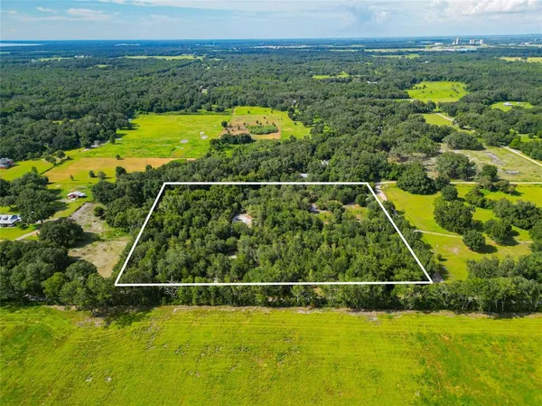 a view of a swimming pool and an outdoor space