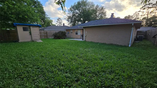 a view of a house with a back yard