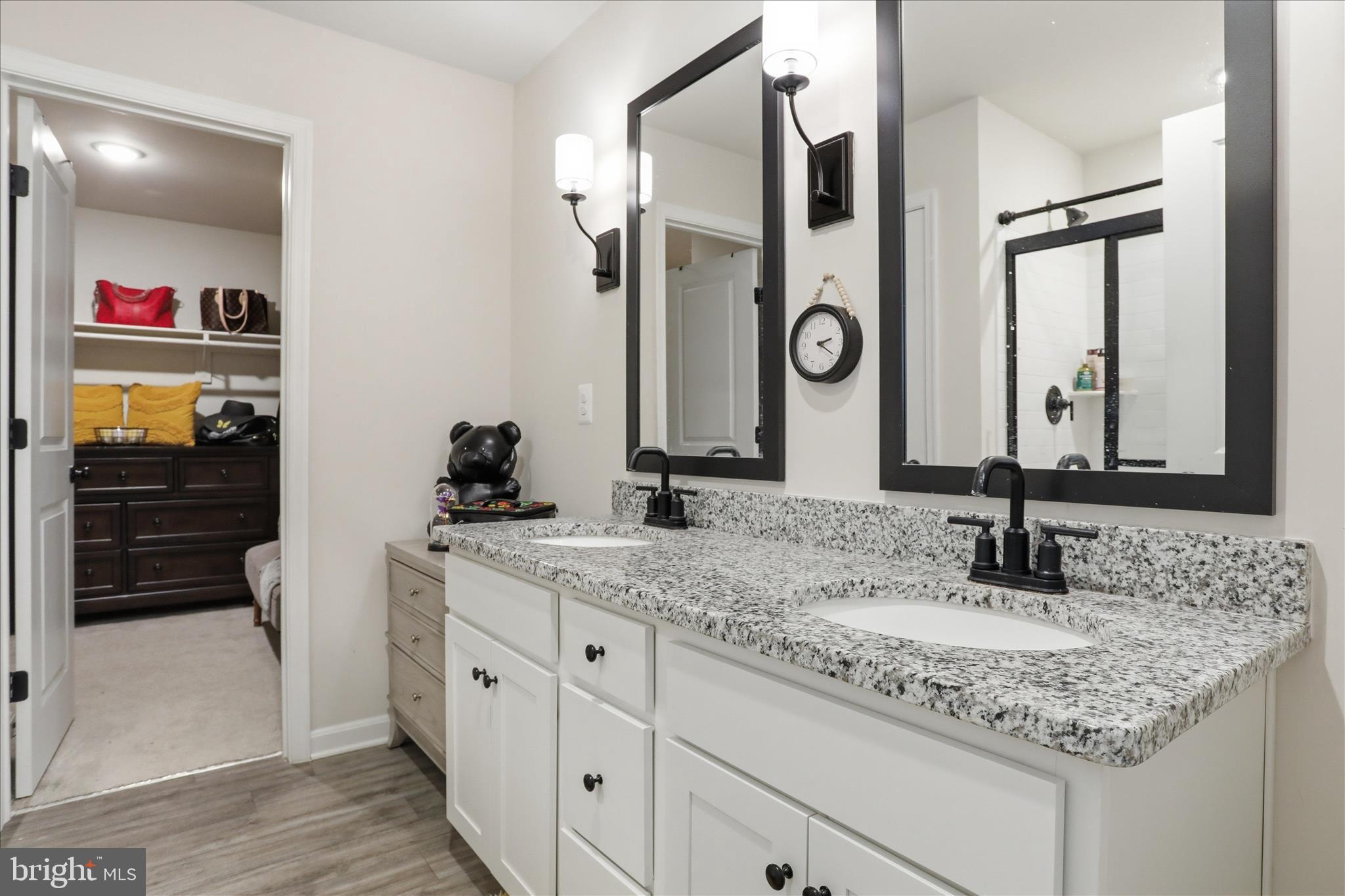76 Diving Scaup Road Hedgesville, WV 25427 - Photo 19 of 48 a bathroom with a granite countertop sink and a mirror