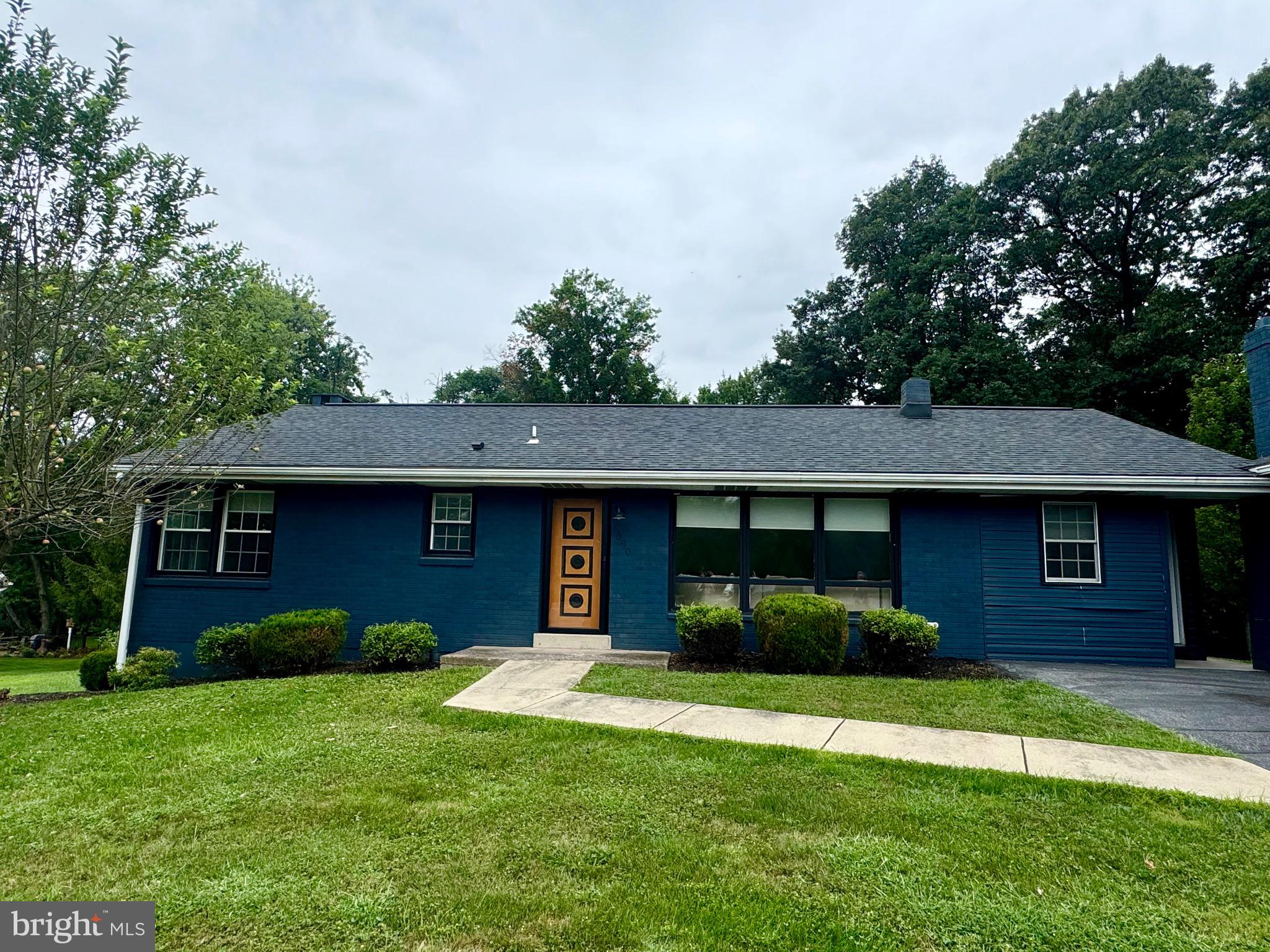 1380 Sand Hill Road Hummelstown, PA 17036 - Photo 1 of 22 a front view of a house with a yard and garage