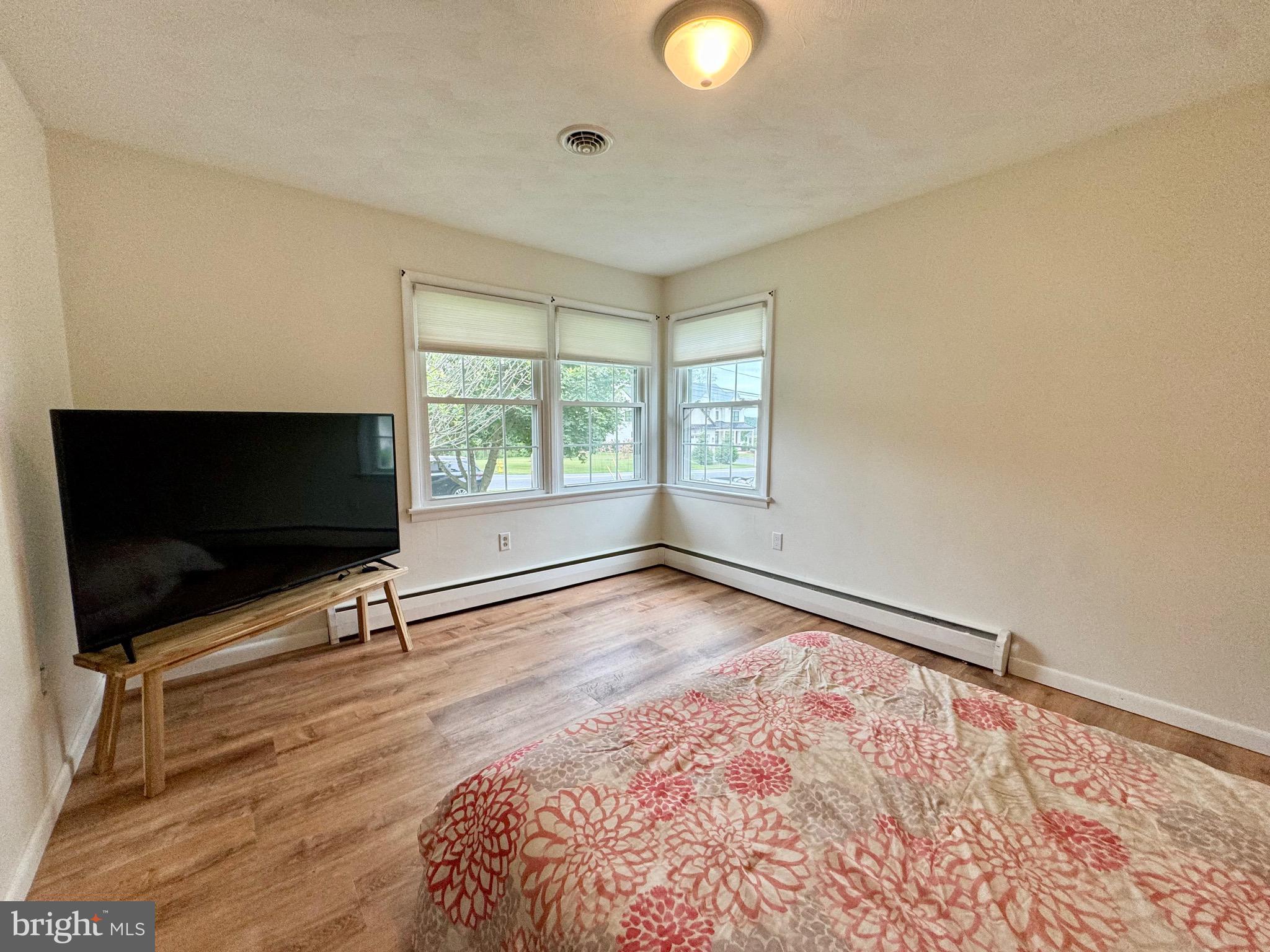 1380 Sand Hill Road Hummelstown, PA 17036 - Photo 13 of 22 a view of an empty room with a window and a flat screen tv