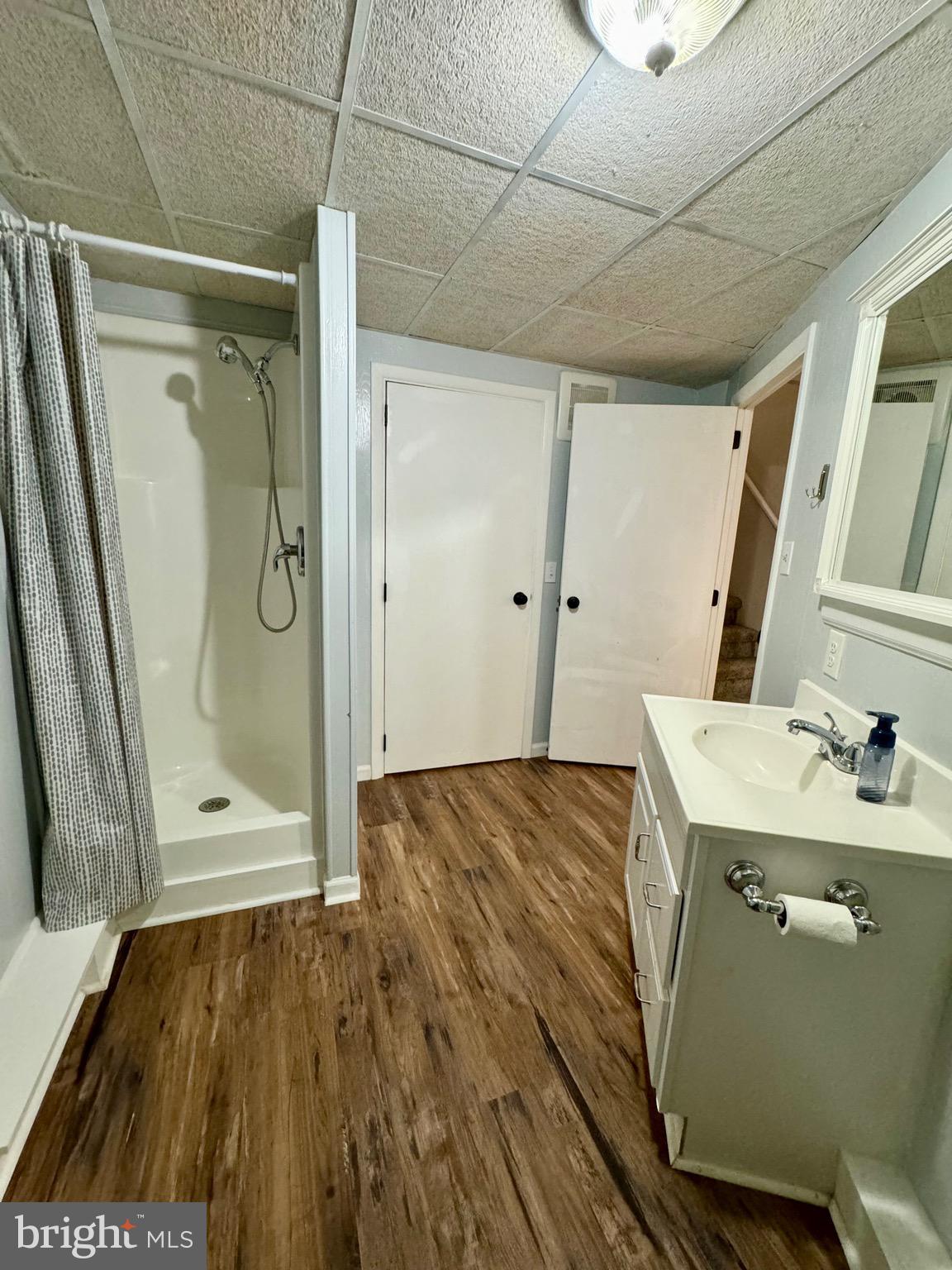 1380 Sand Hill Road Hummelstown, PA 17036 - Photo 18 of 22 a bathroom with a granite countertop sink a mirror and shower