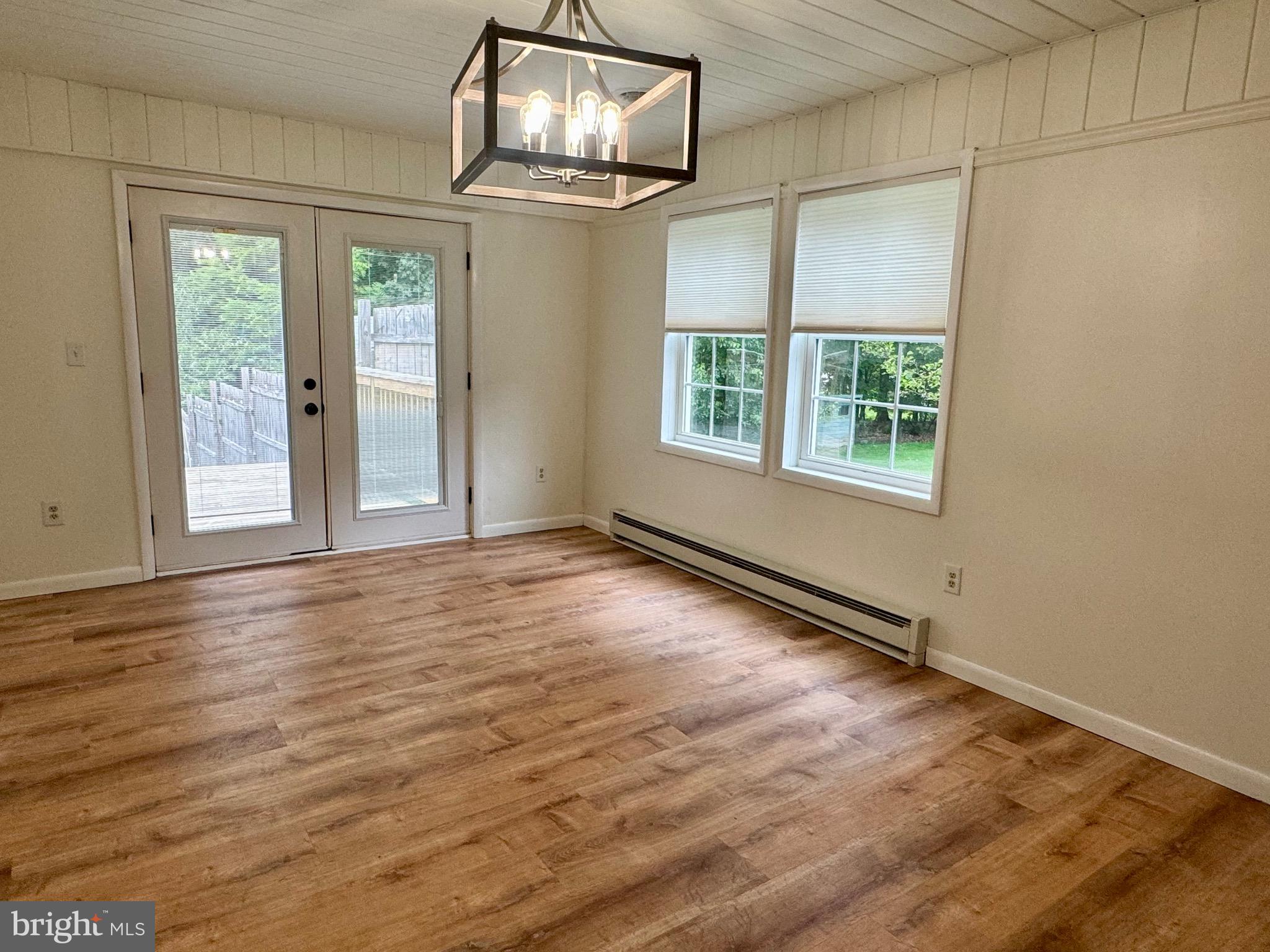 1380 Sand Hill Road Hummelstown, PA 17036 - Photo 3 of 22 an empty room with wooden floor and windows