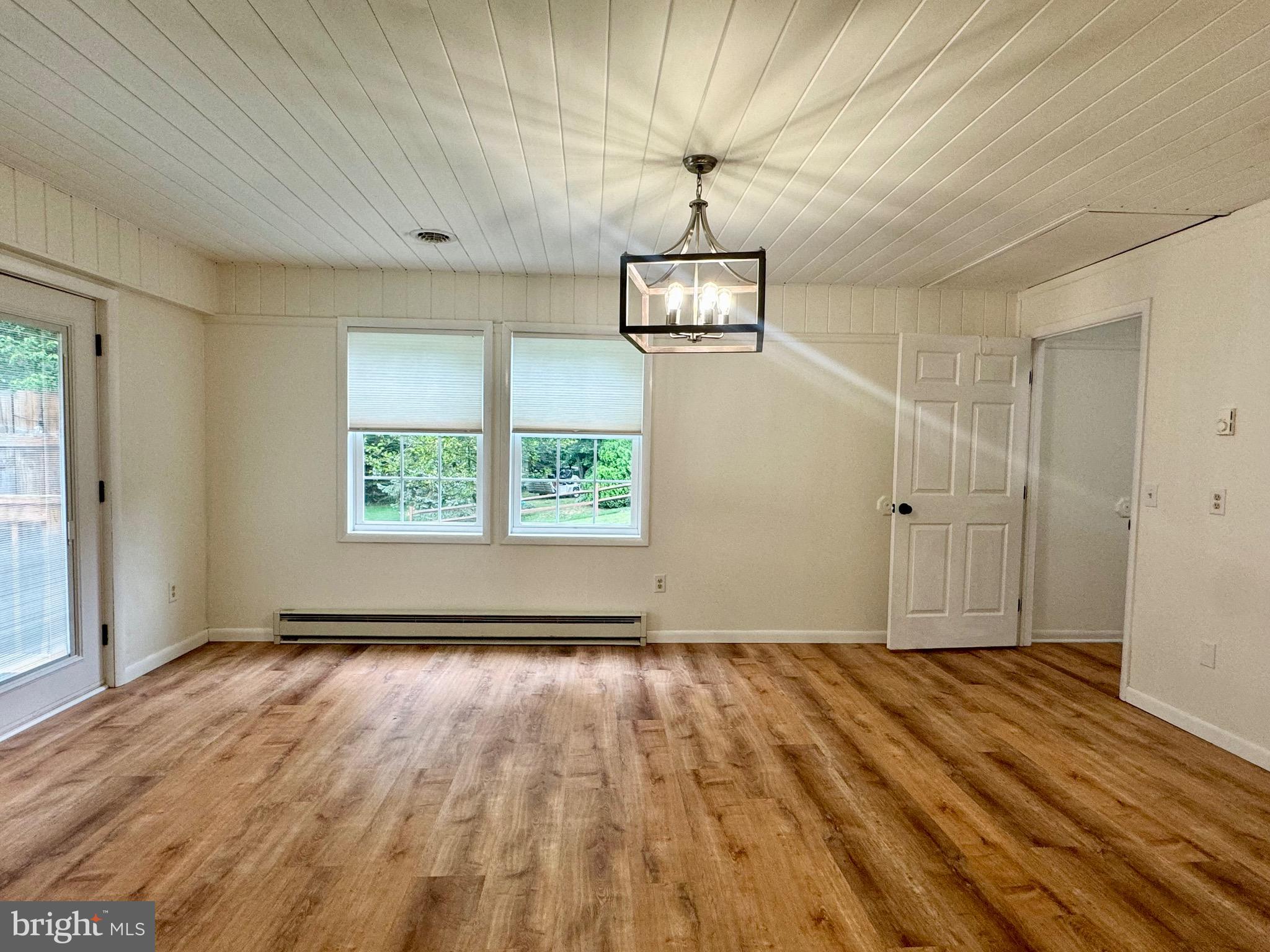 1380 Sand Hill Road Hummelstown, PA 17036 - Photo 4 of 22 wooden floor in an empty room with a window