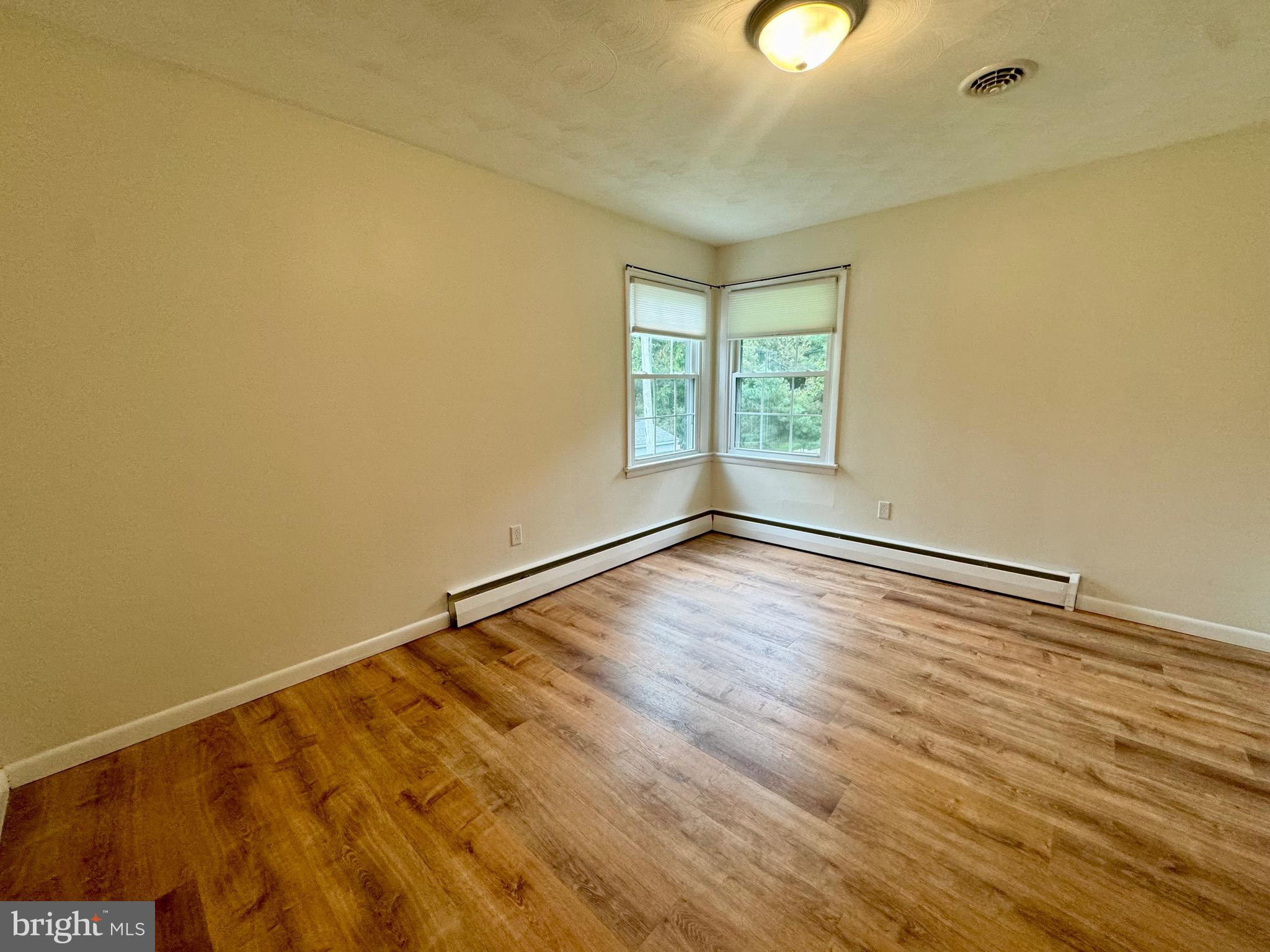1380 Sand Hill Road Hummelstown, PA 17036 - Photo 9 of 22 a view of an empty room with wooden floor and a window
