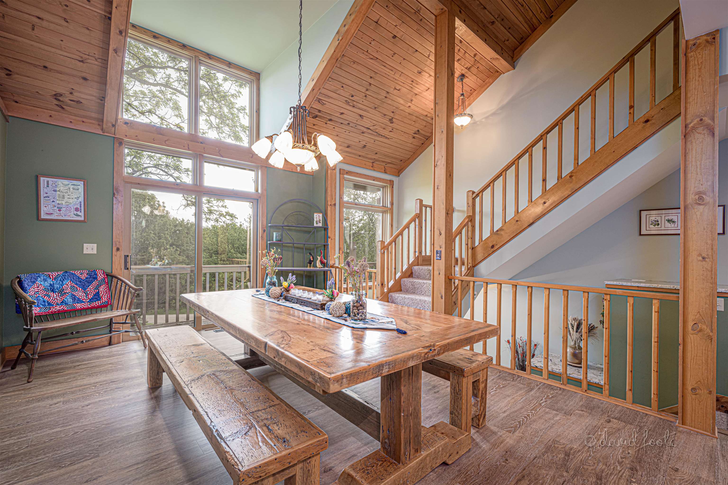 108 West Glen Hollow Road Galena, IL 61036 - Photo 12 of 51 a dining room with furniture a chandelier and wooden floor
