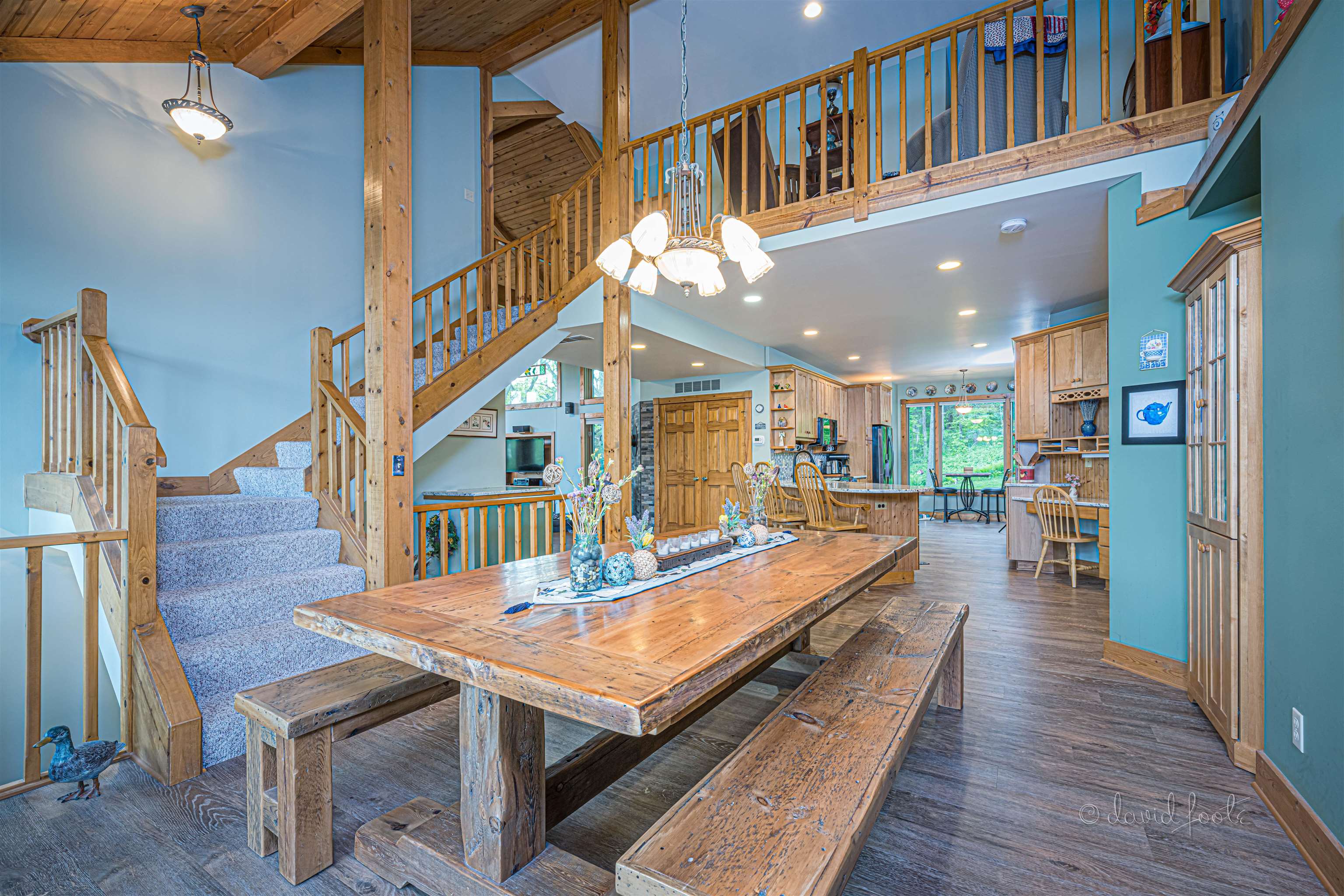108 West Glen Hollow Road Galena, IL 61036 - Photo 13 of 51 a dining room with wooden floor and a chandelier