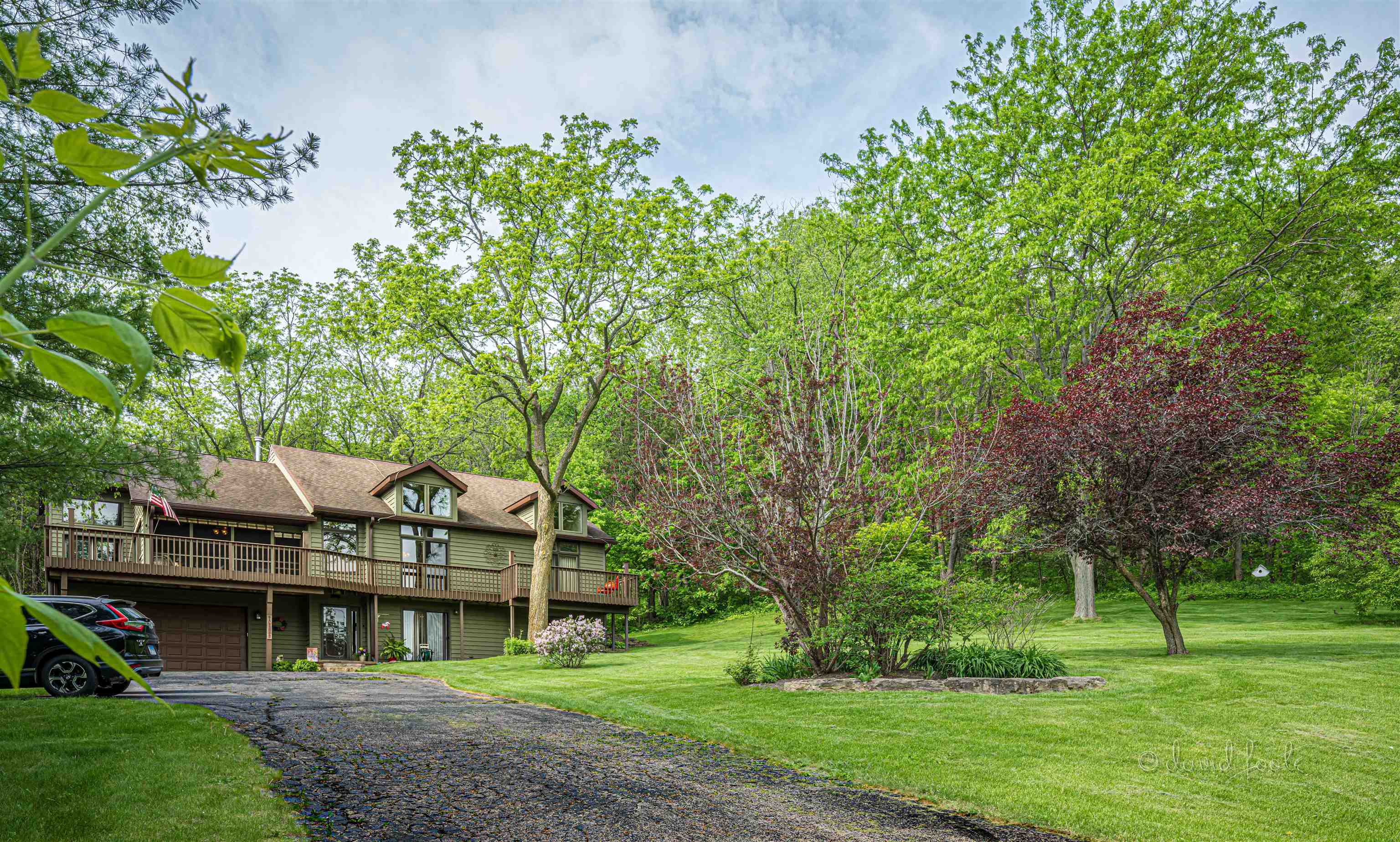 108 West Glen Hollow Road Galena, IL 61036 - Photo 3 of 51 a view of house with a big yard and large trees