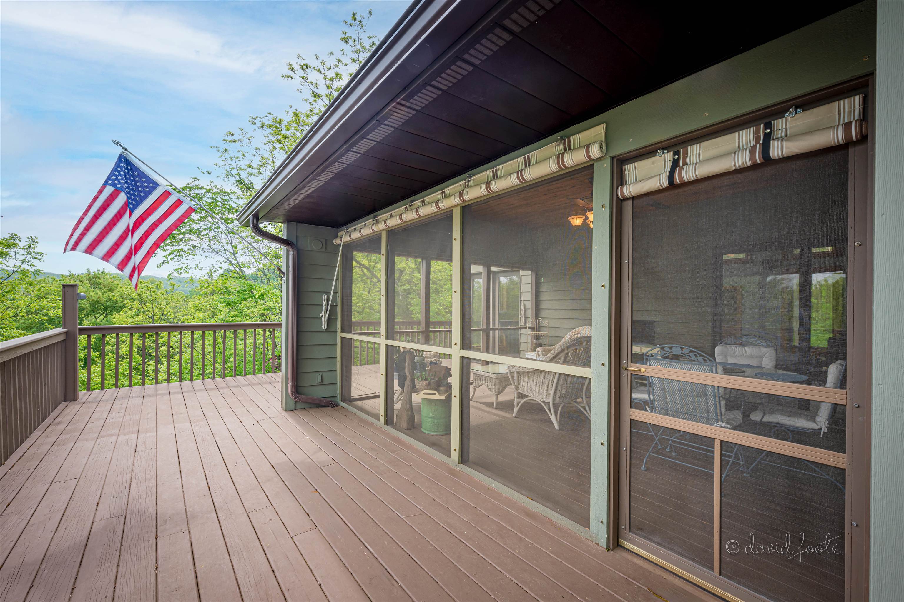 108 West Glen Hollow Road Galena, IL 61036 - Photo 43 of 51 a porch with wooden floor in front of a house