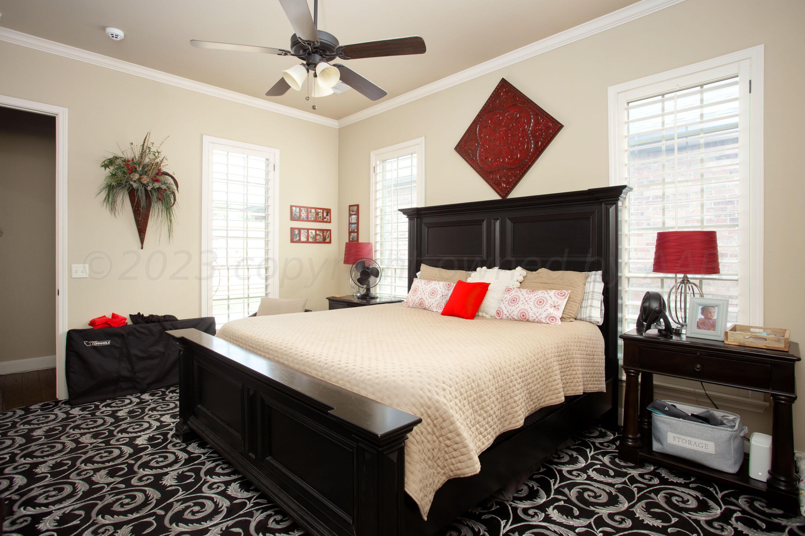 7105 Nick Street Amarillo, TX 79119 - Photo 12 of 24 a bedroom with a bed and a dresser
