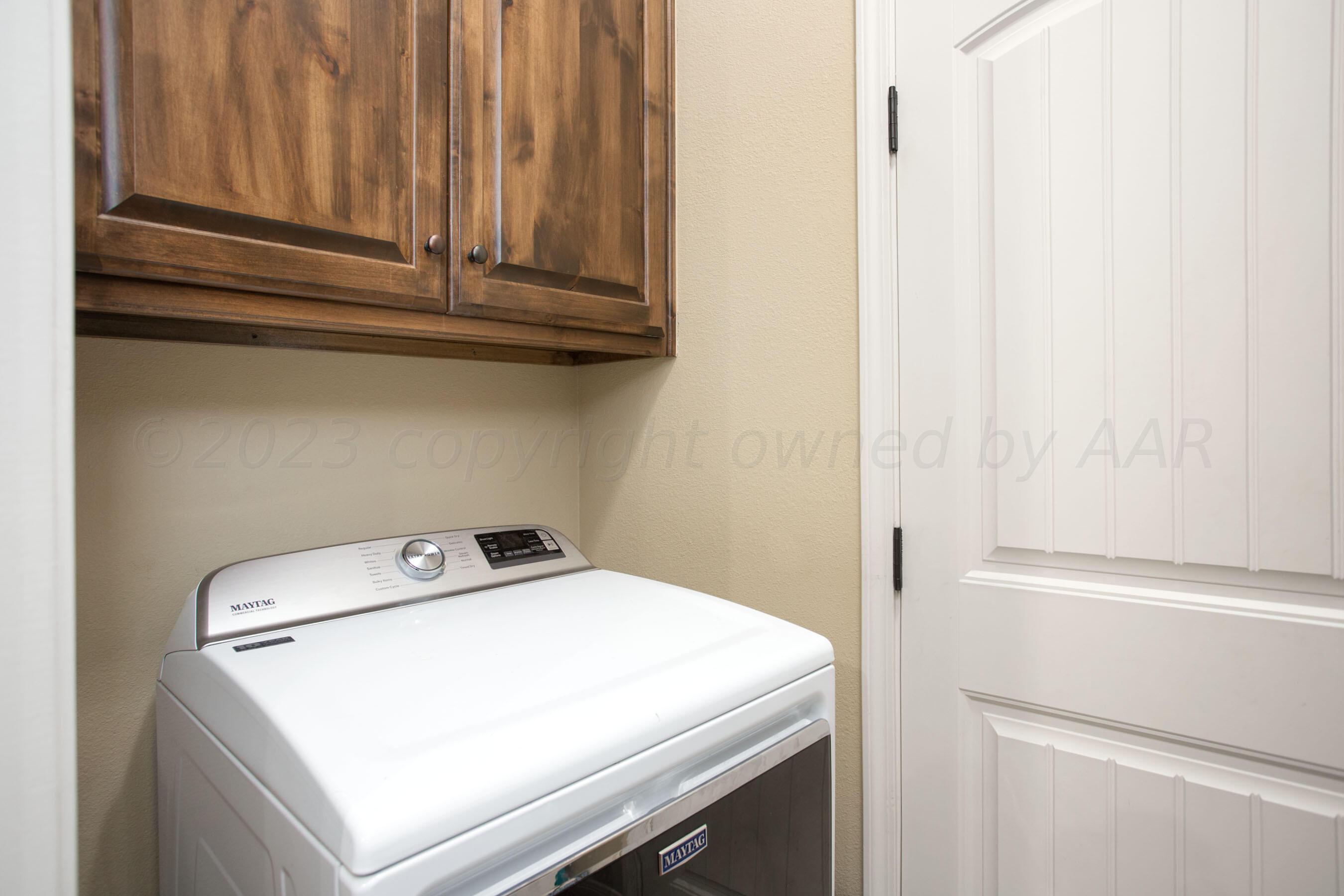 7105 Nick Street Amarillo, TX 79119 - Photo 20 of 24 a utility room with dryer and washer