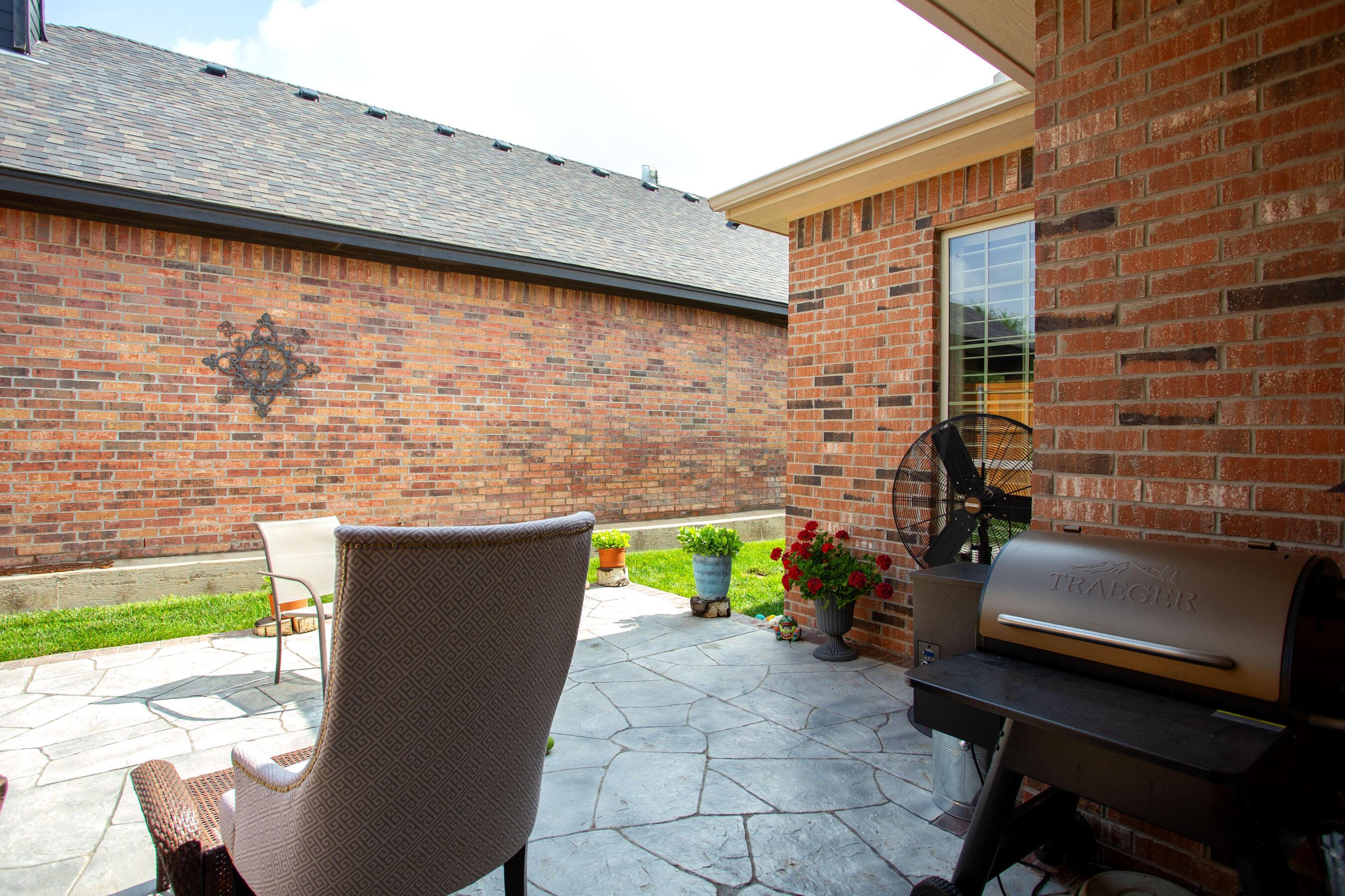 7105 Nick Street Amarillo, TX 79119 - Photo 21 of 24 a brick building with a bench in front of it