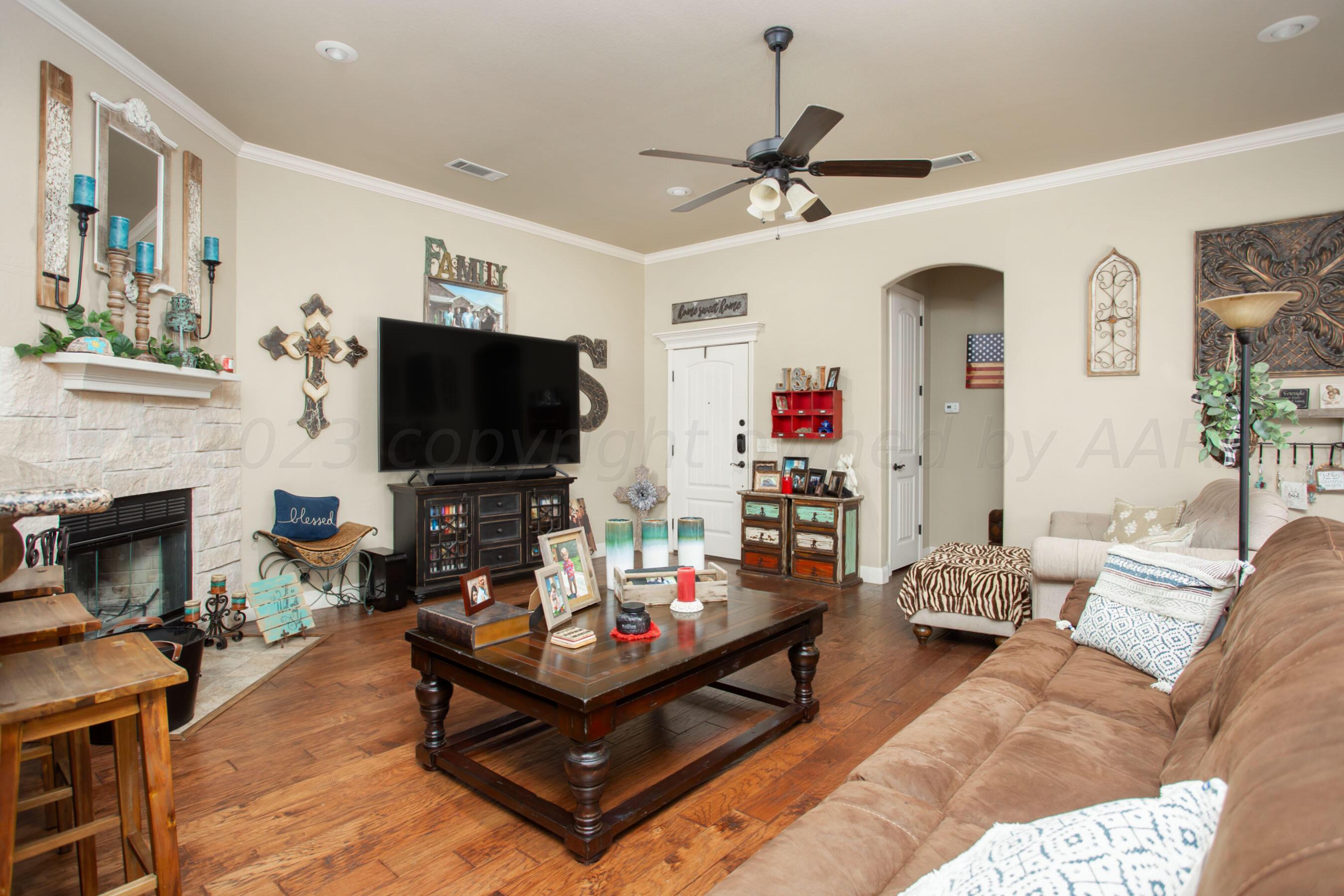 7105 Nick Street Amarillo, TX 79119 - Photo 4 of 24 a living room with furniture and a flat screen tv