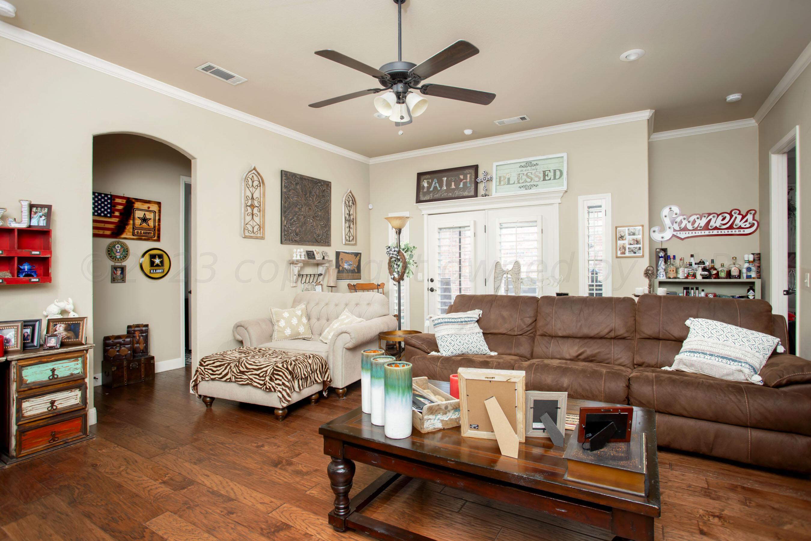 7105 Nick Street Amarillo, TX 79119 - Photo 5 of 24 a living room with furniture and wooden floor