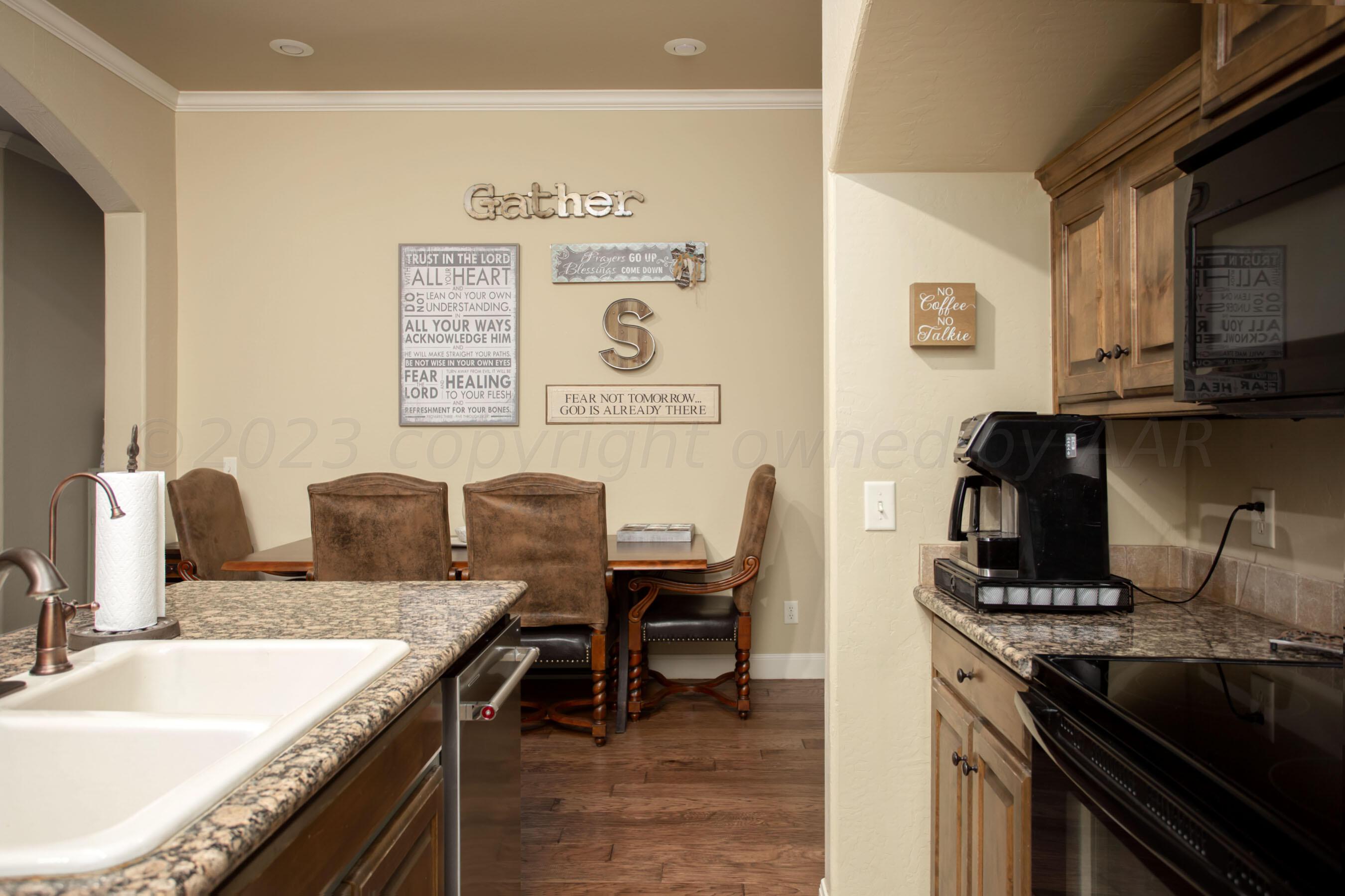 7105 Nick Street Amarillo, TX 79119 - Photo 9 of 24 a kitchen with a stove and a sink