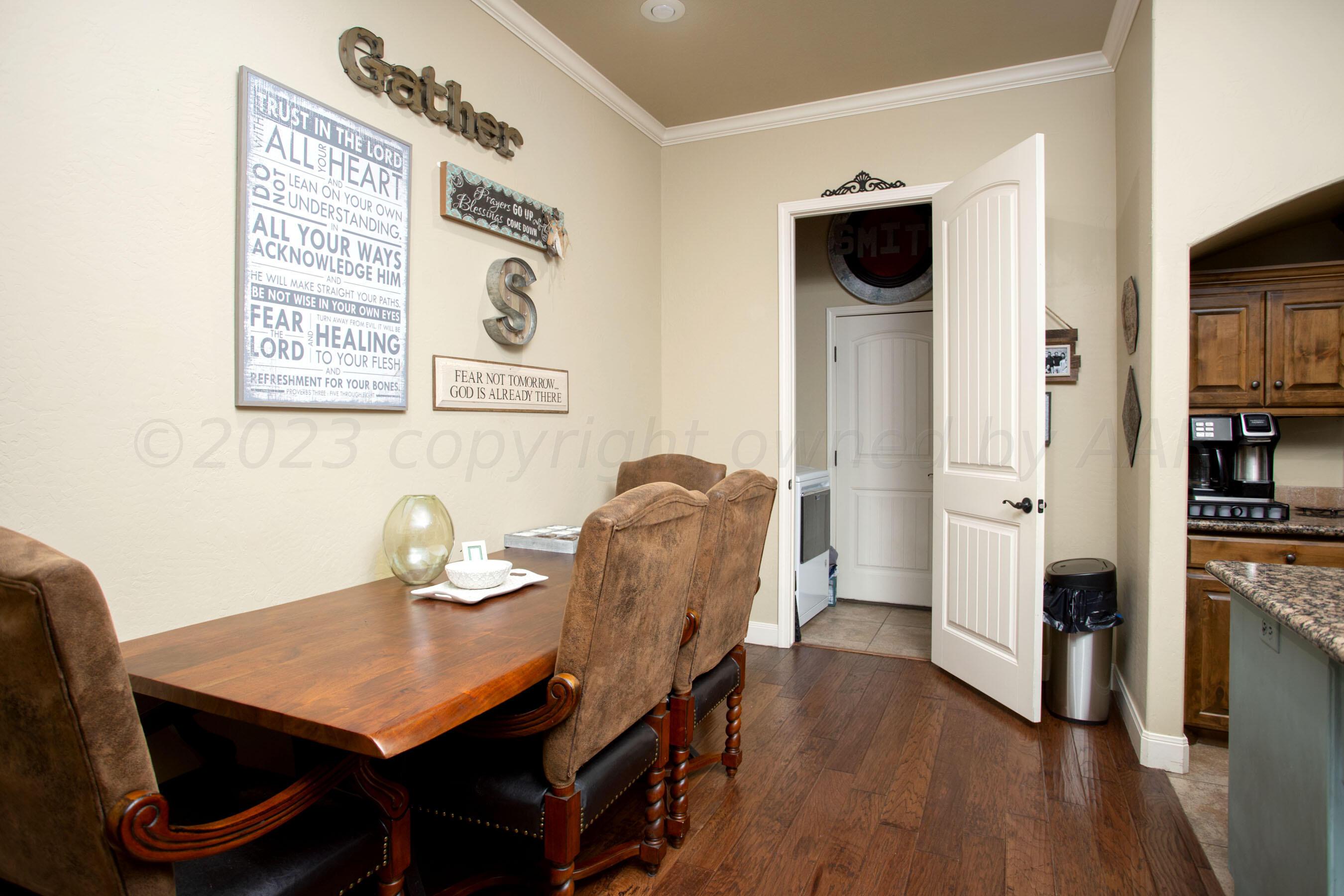 7105 Nick Street Amarillo, TX 79119 - Photo 10 of 24 a view of a workspace with furniture and wooden floor
