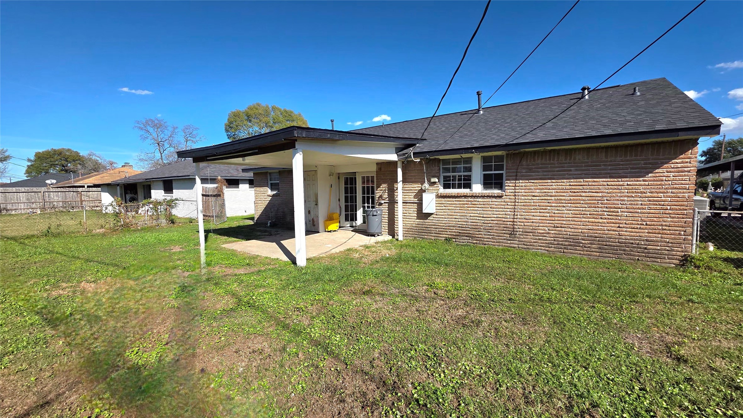 727 Dell Dale Street Channelview, TX 77530 - Photo 14 of 14 a view of a house with a yard patio and a garden