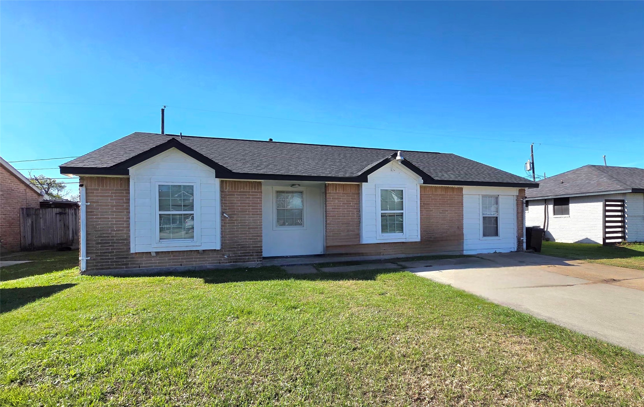 727 Dell Dale Street Channelview, TX 77530 - Photo 2 of 14 a front view of a house with a yard and garage