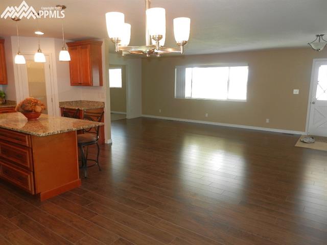 16555 Bar X Road Colorado Springs, CO 80908 - Photo 16 of 36 This is from the dining area across the Great-room. The views are great from all around the home, but you'll really love the views out the large front window.