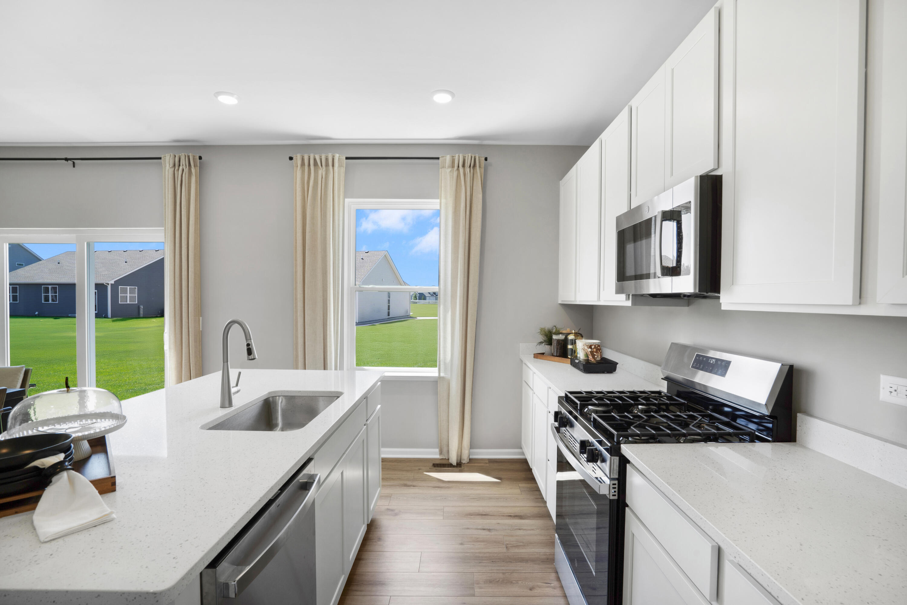 5575 Buttercup Avenue Portage, IN 46368 - Photo 4 of 16 a kitchen with stainless steel appliances granite countertop a sink stove and refrigerator