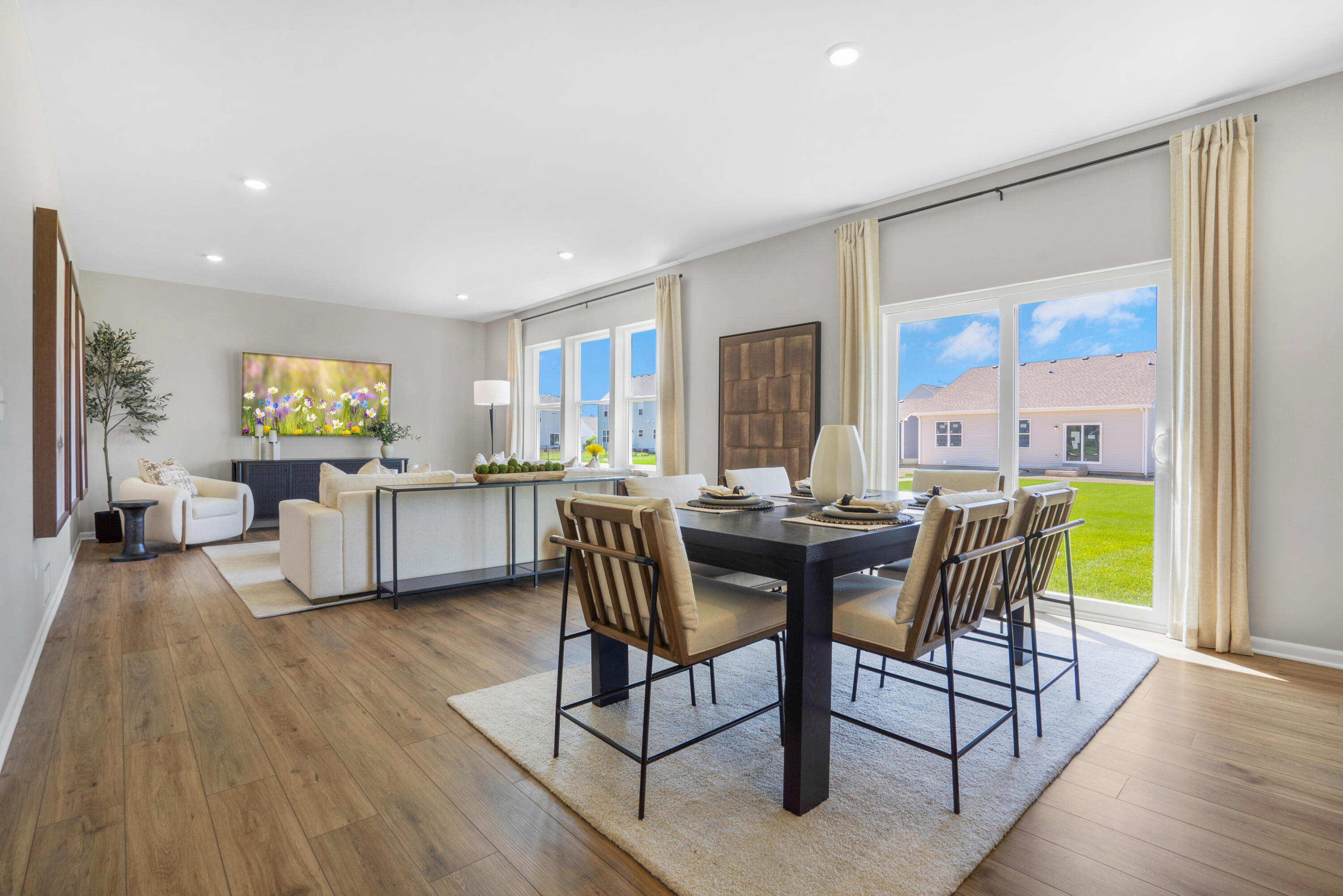 5575 Buttercup Avenue Portage, IN 46368 - Photo 6 of 16 a view of a dining room with furniture a chandelier and wooden floor