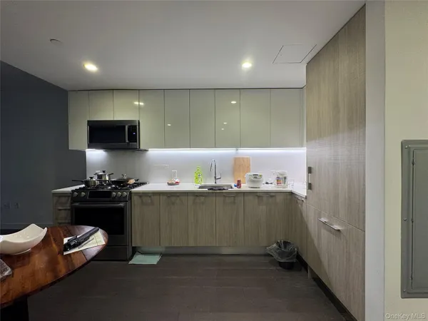 a kitchen with a stove and a refrigerator