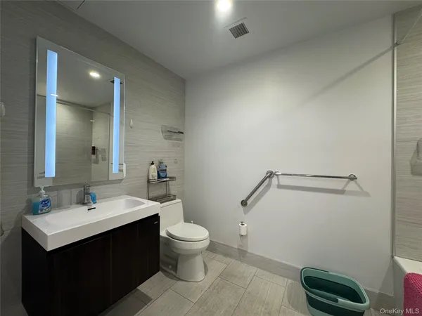 a bathroom with a shower and a bath tub