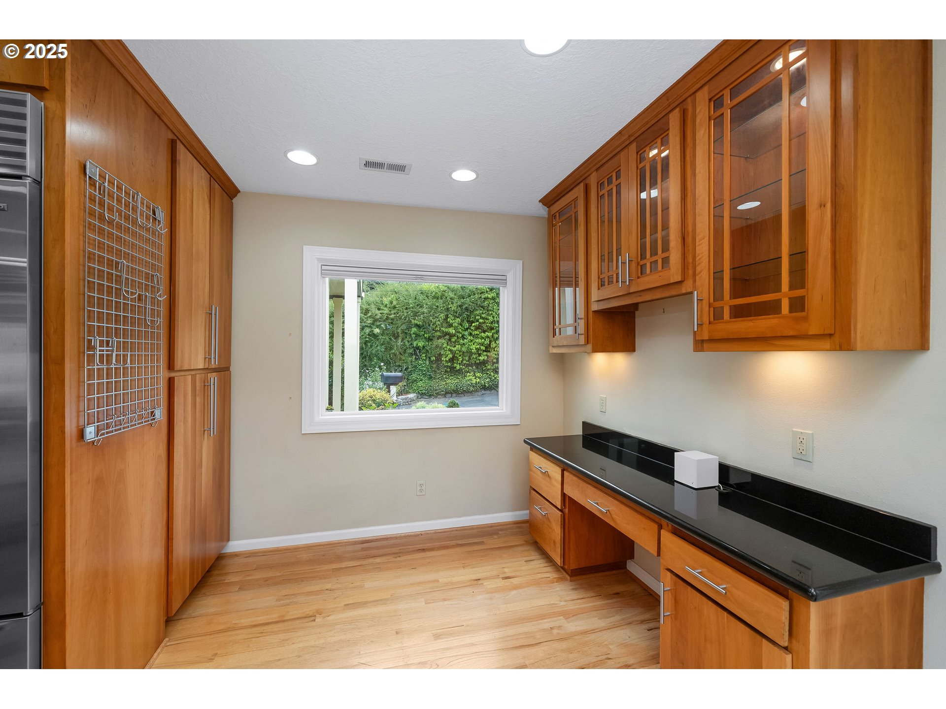 3250 Southwest Donner Way Court Portland, OR 97239 - Photo 11 of 48 a kitchen with stainless steel appliances granite countertop a refrigerator and a sink