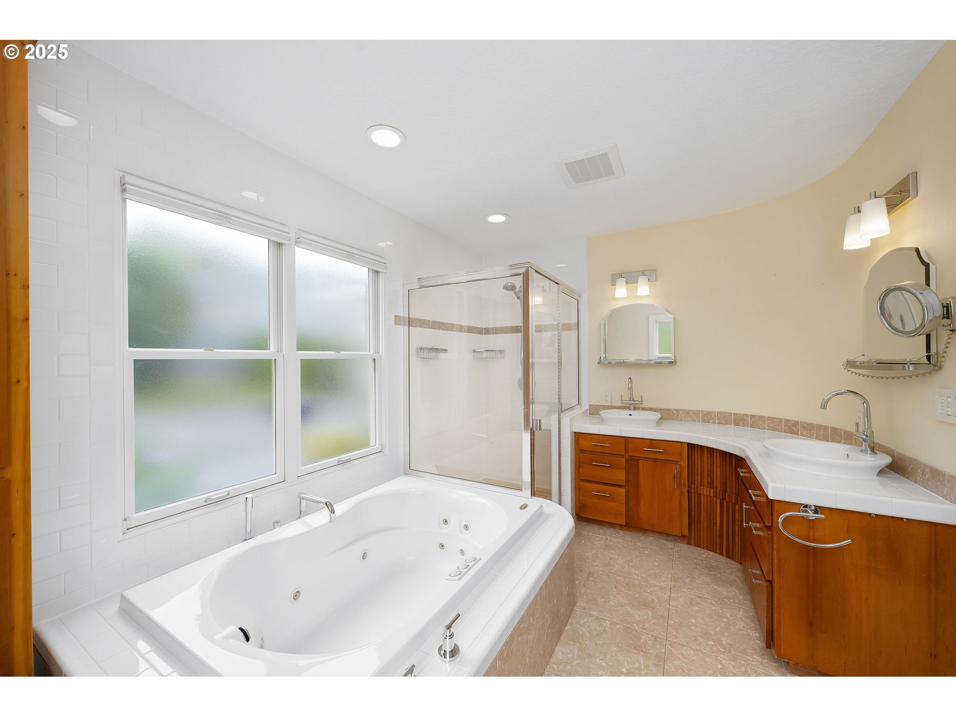 3250 Southwest Donner Way Court Portland, OR 97239 - Photo 17 of 48 a bathroom with a tub sink double vanity granite and shower