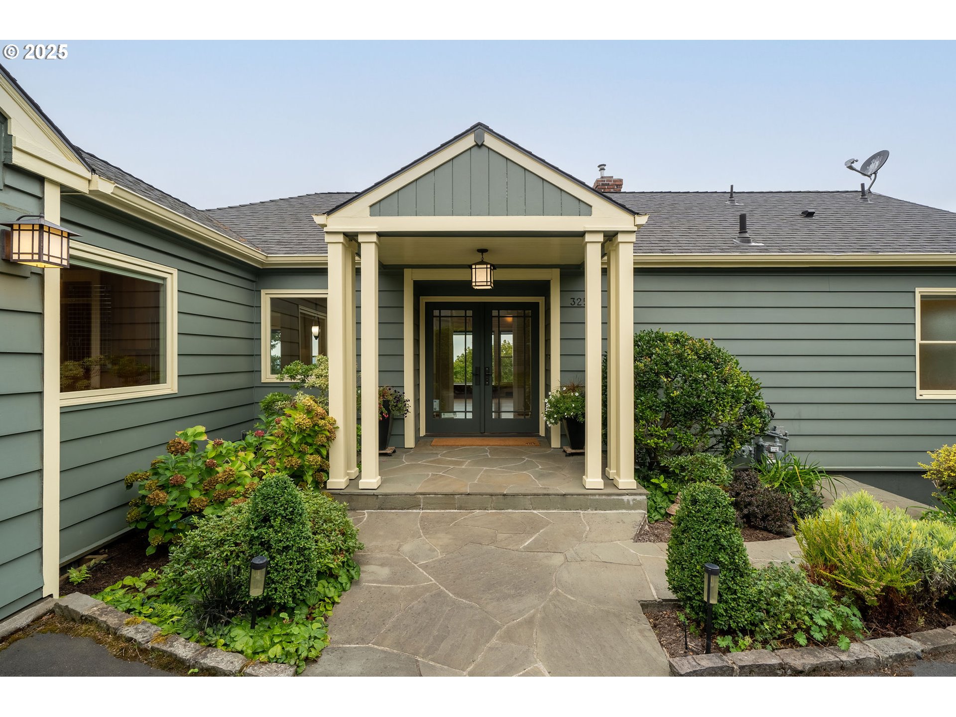3250 Southwest Donner Way Court Portland, OR 97239 - Photo 2 of 48 a front view of a house with garden