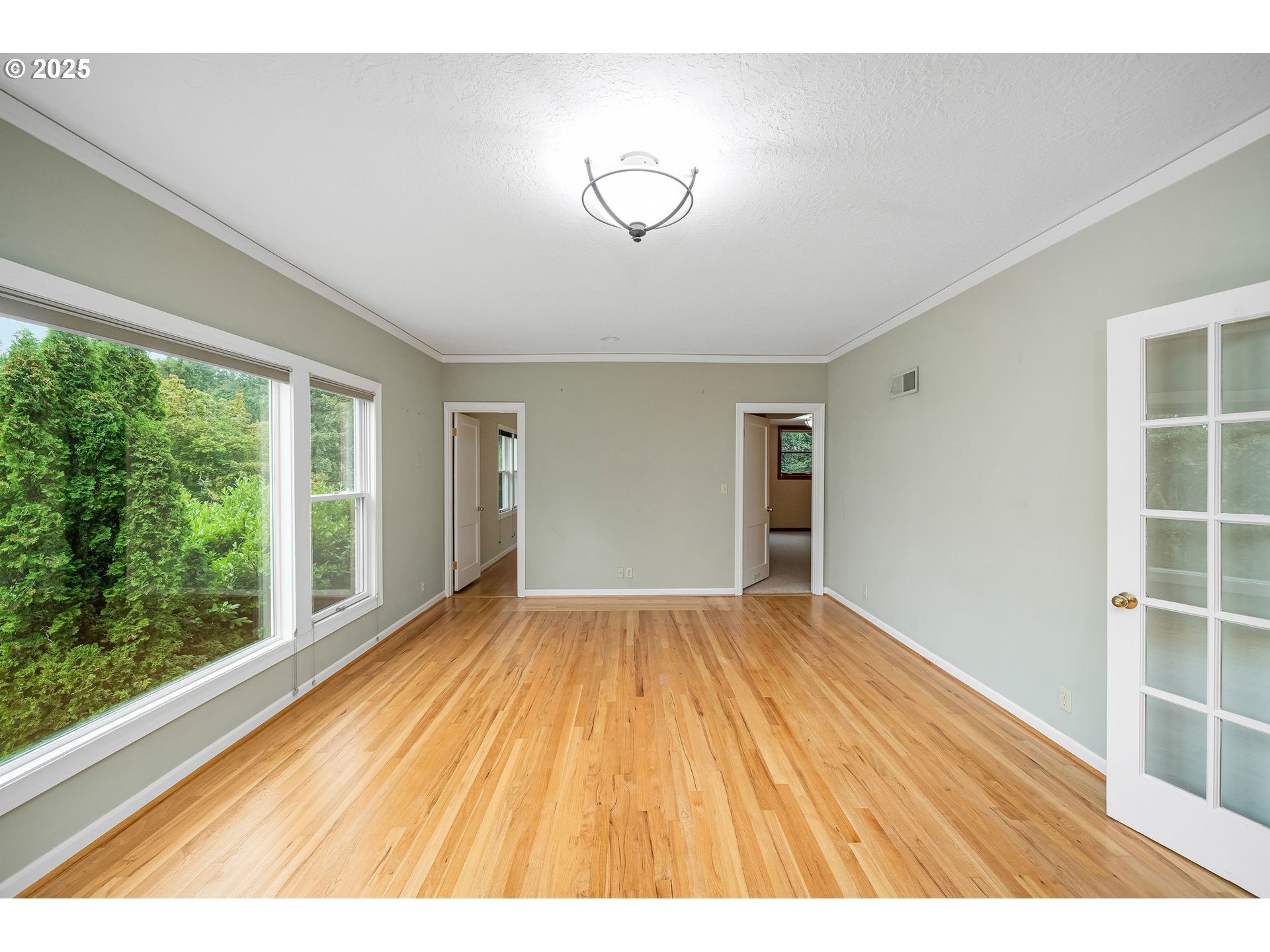3250 Southwest Donner Way Court Portland, OR 97239 - Photo 23 of 48 a view of an empty room with wooden floor and a window