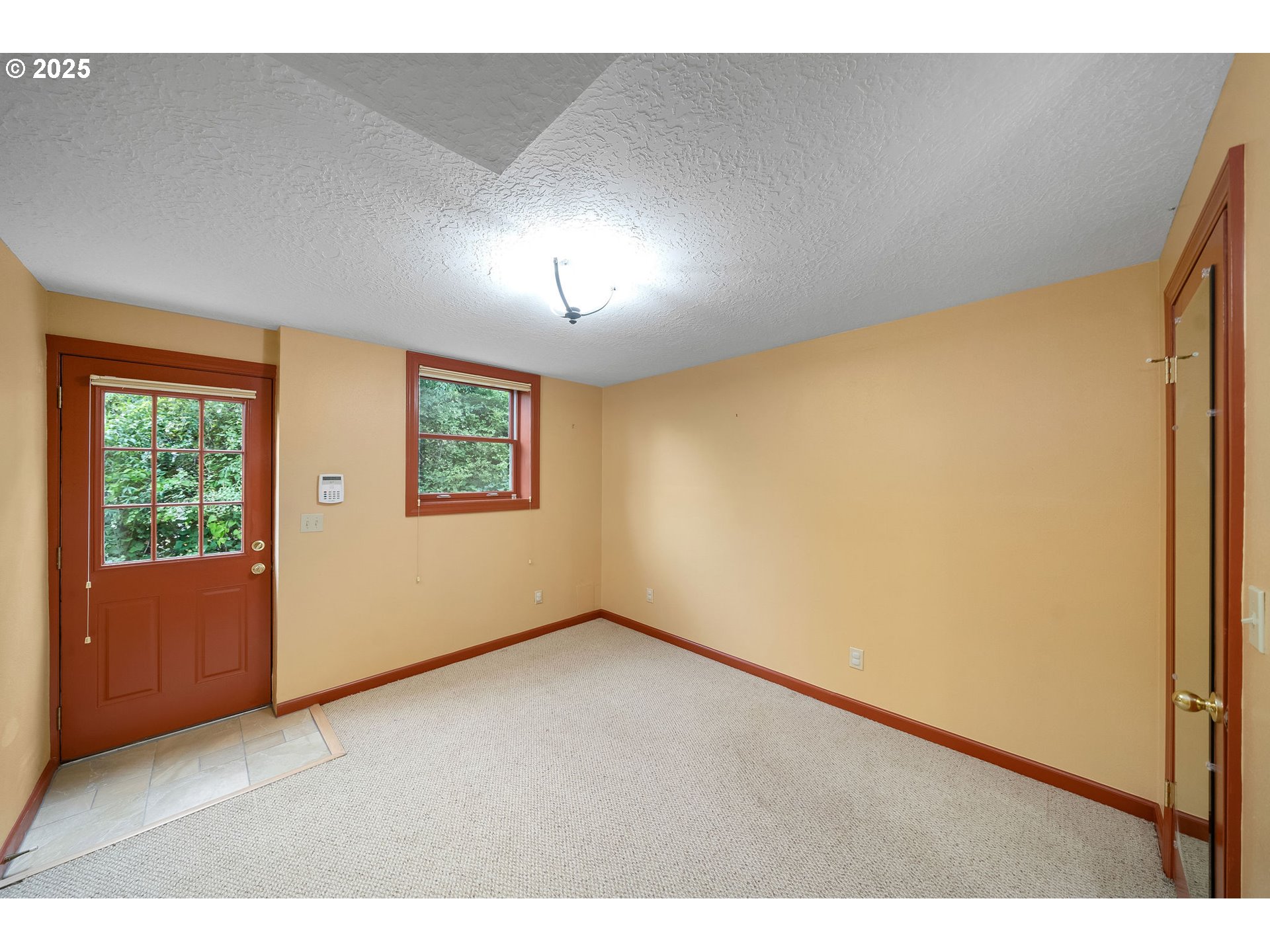 3250 Southwest Donner Way Court Portland, OR 97239 - Photo 26 of 48 a view of an empty room with a window