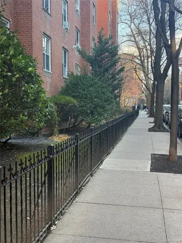 a balcony with trees in front of it