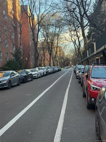 a view of a street with cars