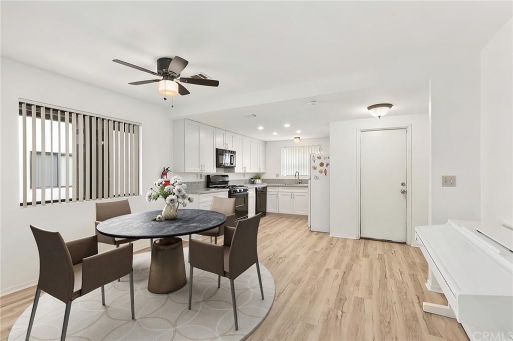1467 Nolette Avenue Hemet, CA 92545 - Photo 4 of 10 a view of a dining room with furniture and a chandelier