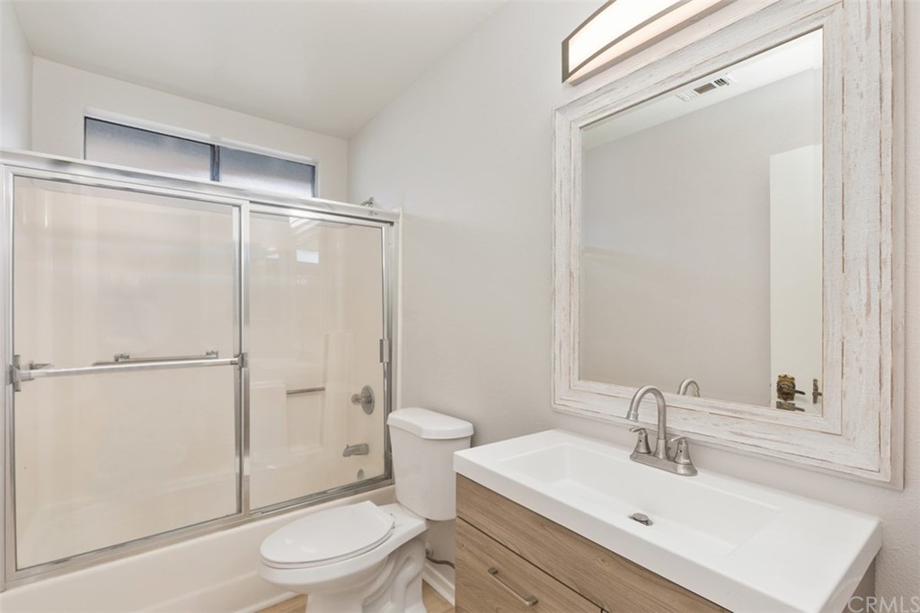 1467 Nolette Avenue Hemet, CA 92545 - Photo 7 of 10 a bathroom with a sink toilet and shower