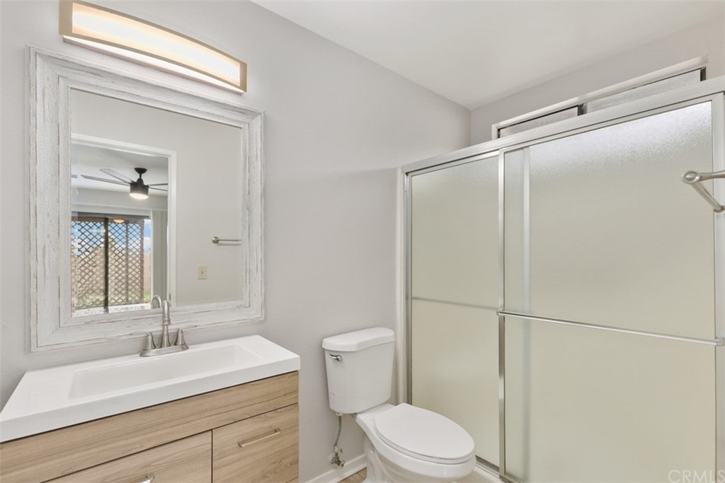 1467 Nolette Avenue Hemet, CA 92545 - Photo 9 of 10 a bathroom with a sink a toilet and shower