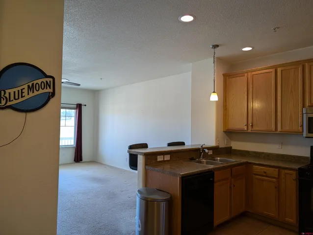 a view of a kitchen with a sink