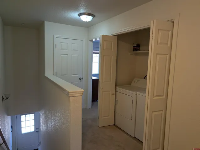 a bathroom with a shower and closet