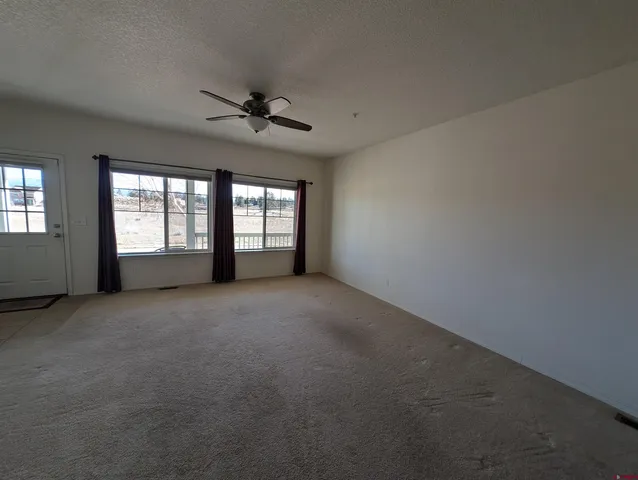a view of empty room with windows