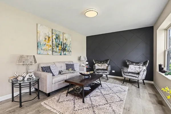 a living room with furniture and a rug